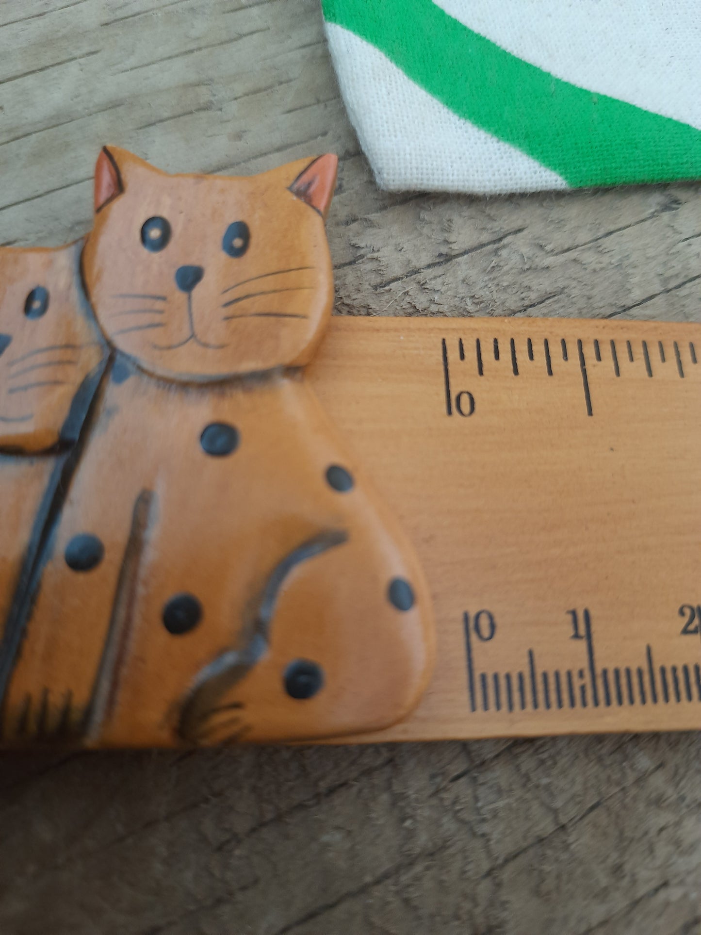 Light brown wooden cat ruler