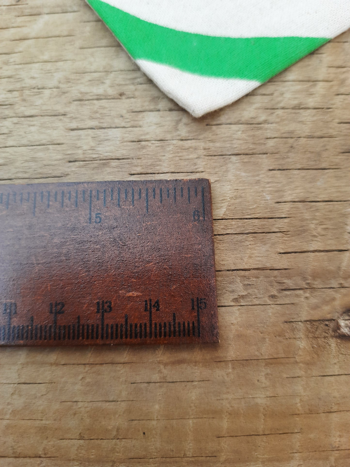 Dark brown ruler with cat design