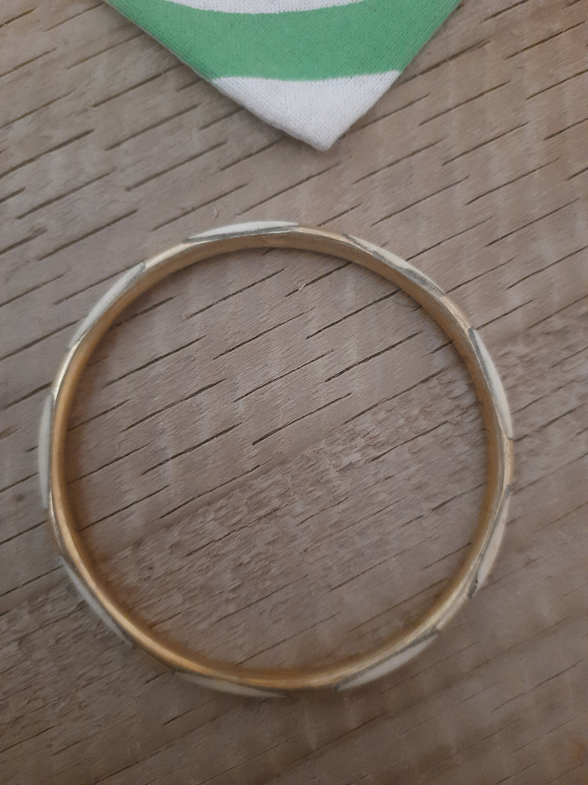 Three gold and cream bangles
