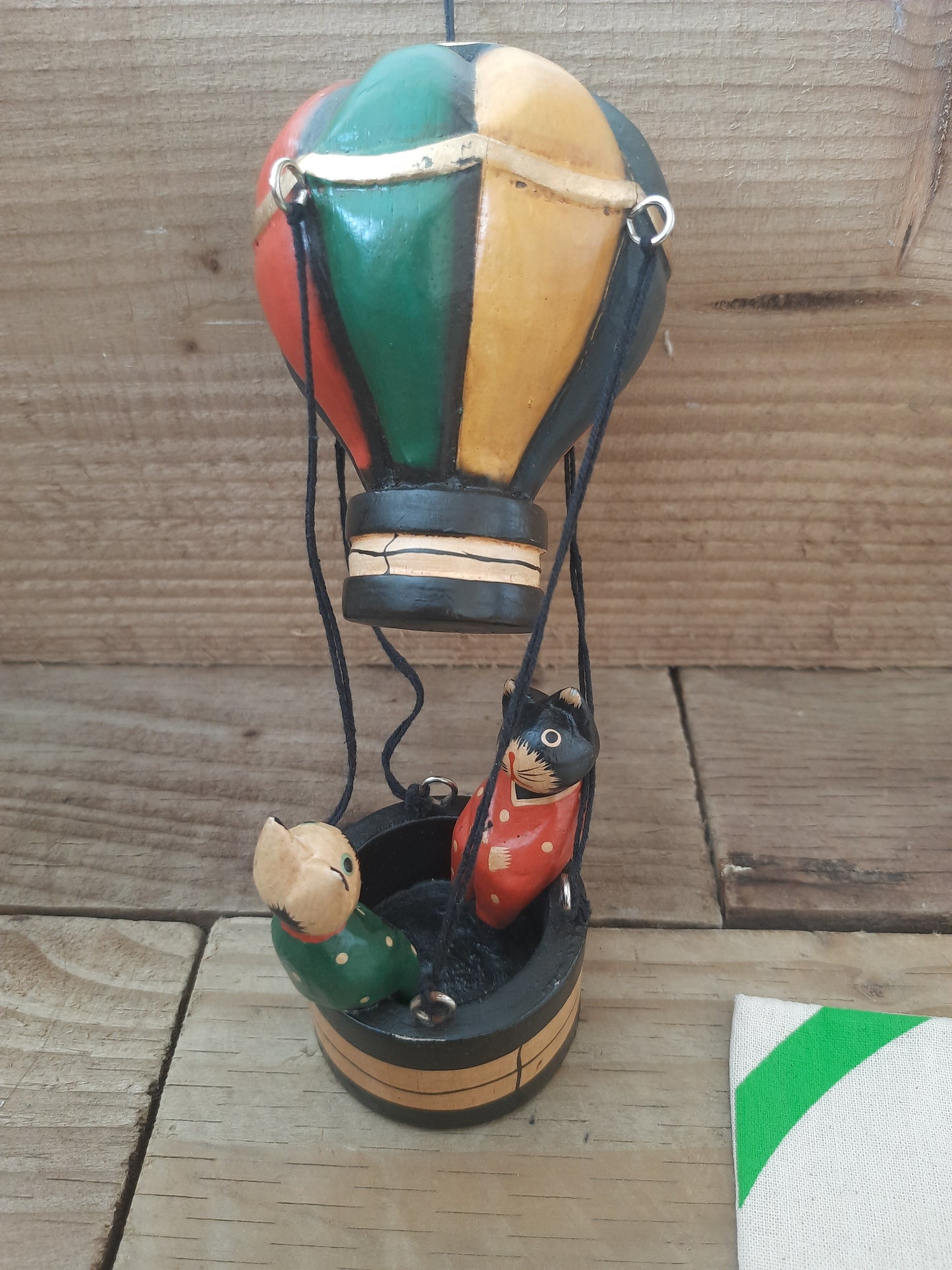 Whiskers in the Sky: Wooden Cats in a Balloon”