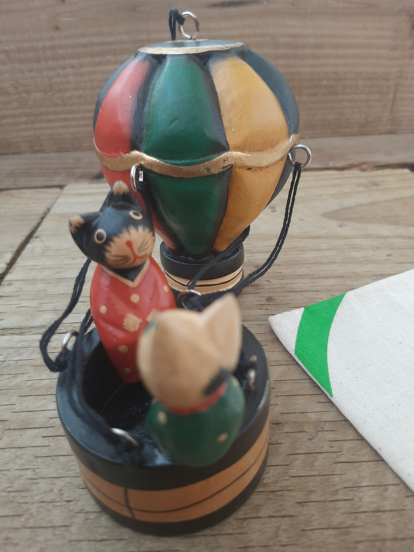 Whiskers in the Sky: Wooden Cats in a Balloon”