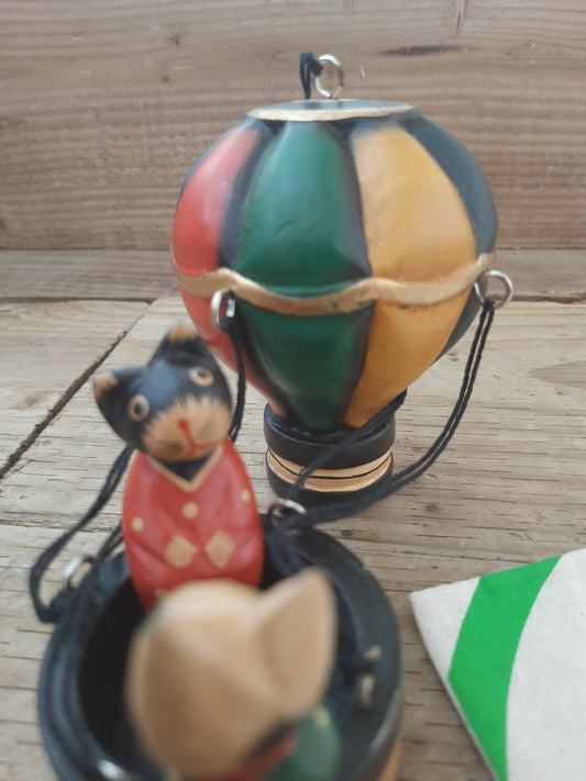 Whiskers in the Sky: Wooden Cats in a Balloon”