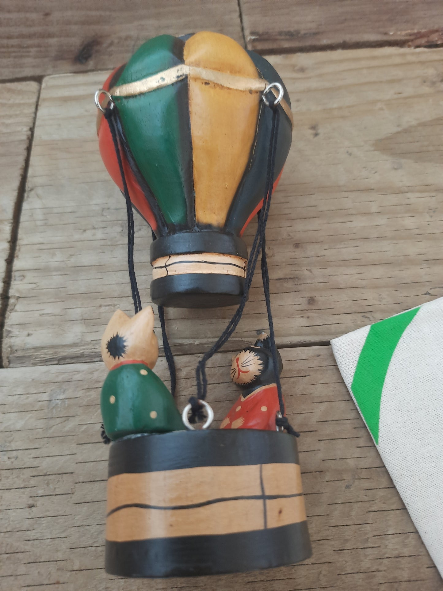 Whiskers in the Sky: Wooden Cats in a Balloon”