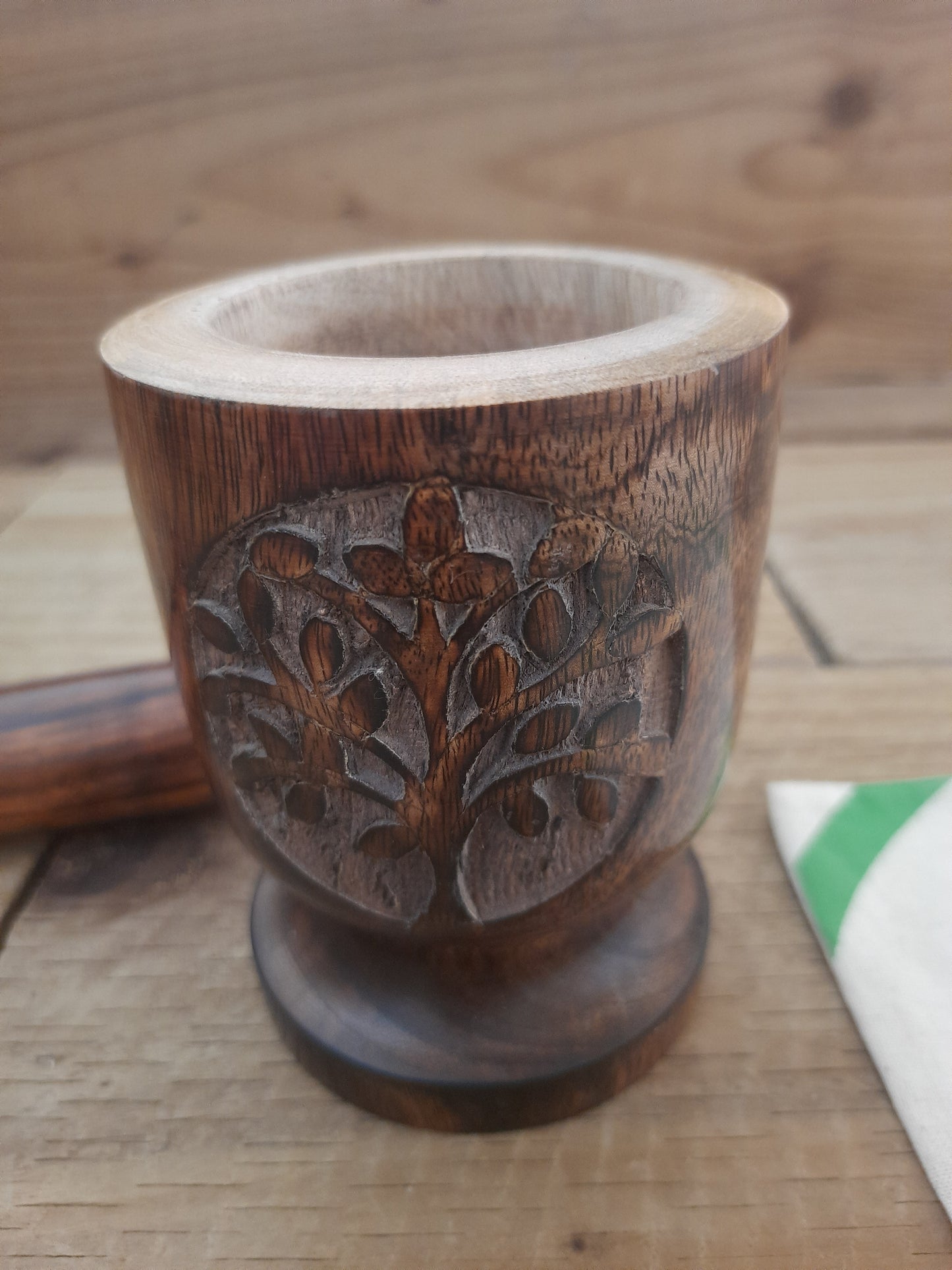 Detailed floral engraving on mango wood pestle