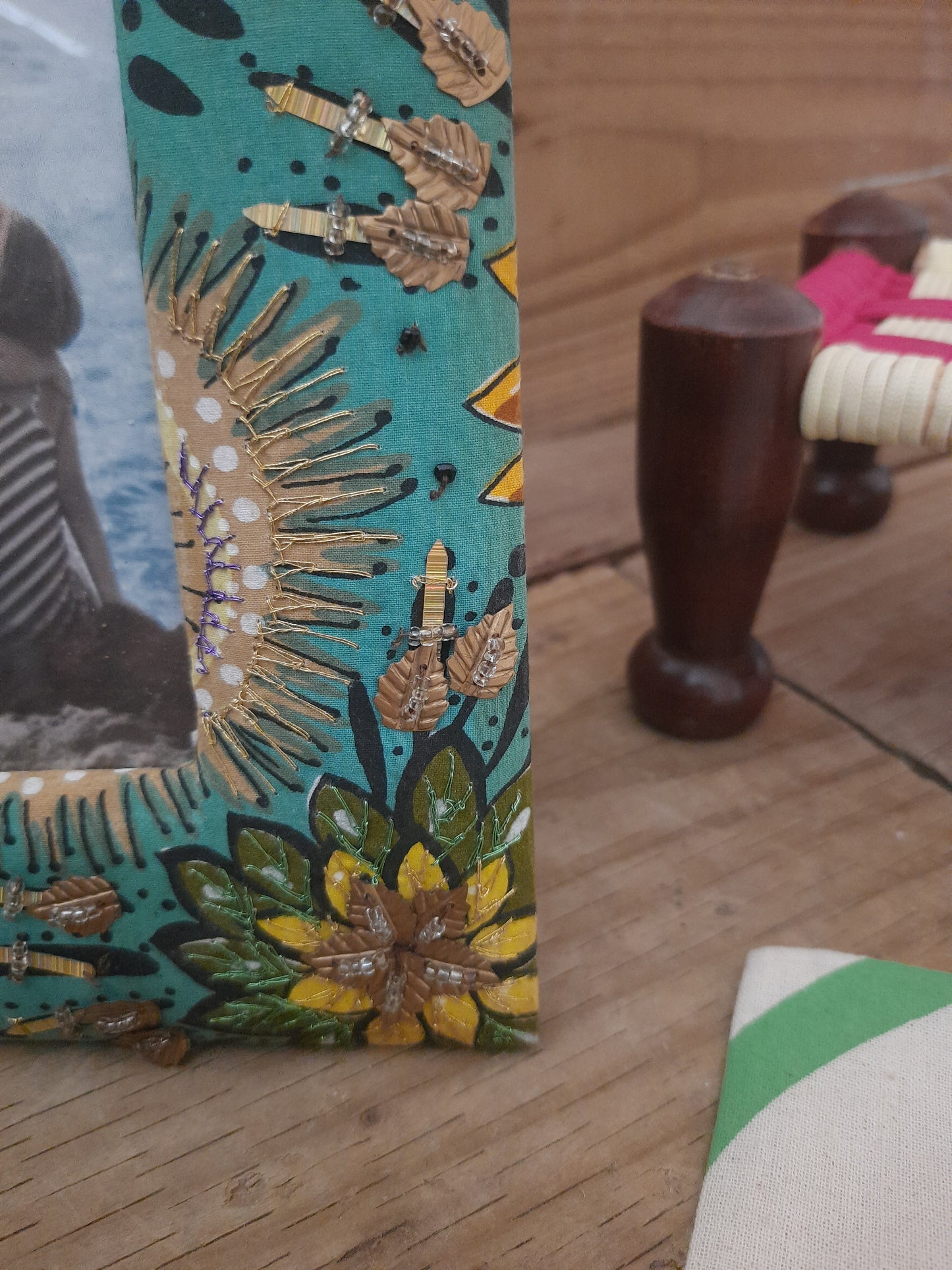 Green floral wooden photo frame detail