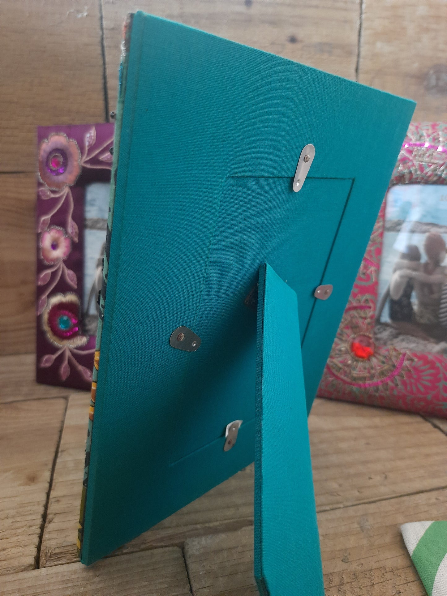 Close-up of green floral fabric photo frame