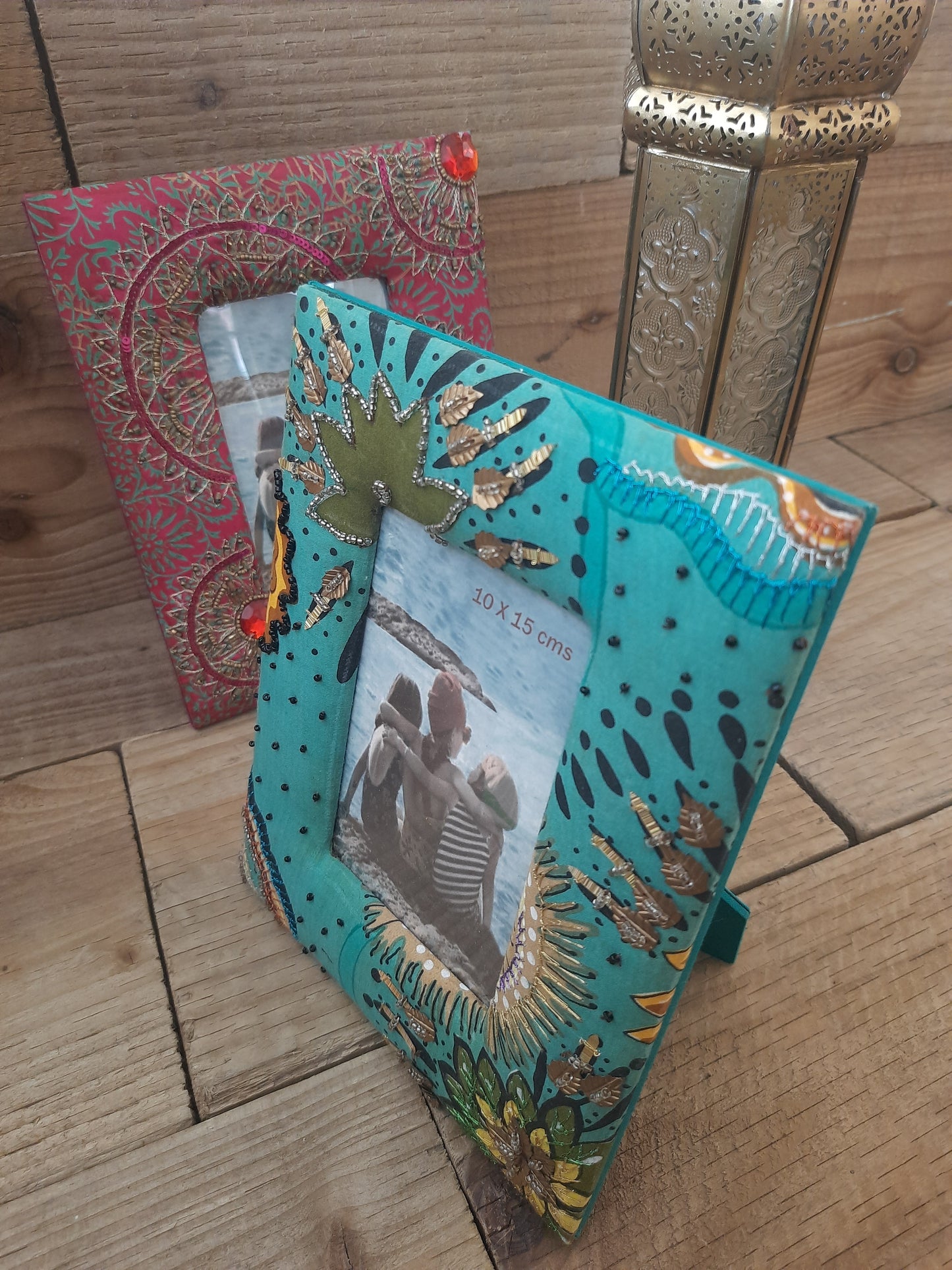Floral photo frame with green fabric covering