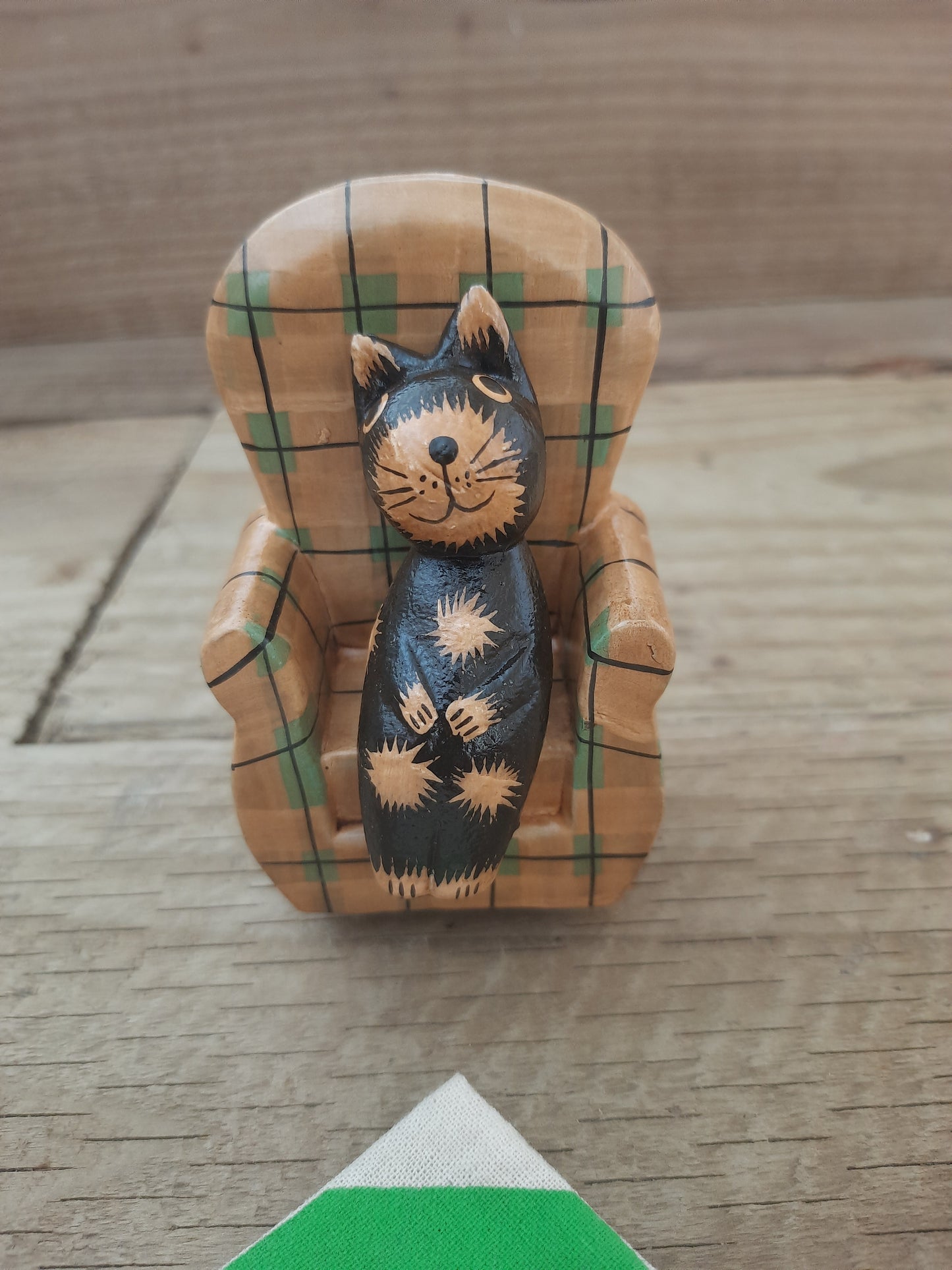 Wood Cat Lounging on Sofa