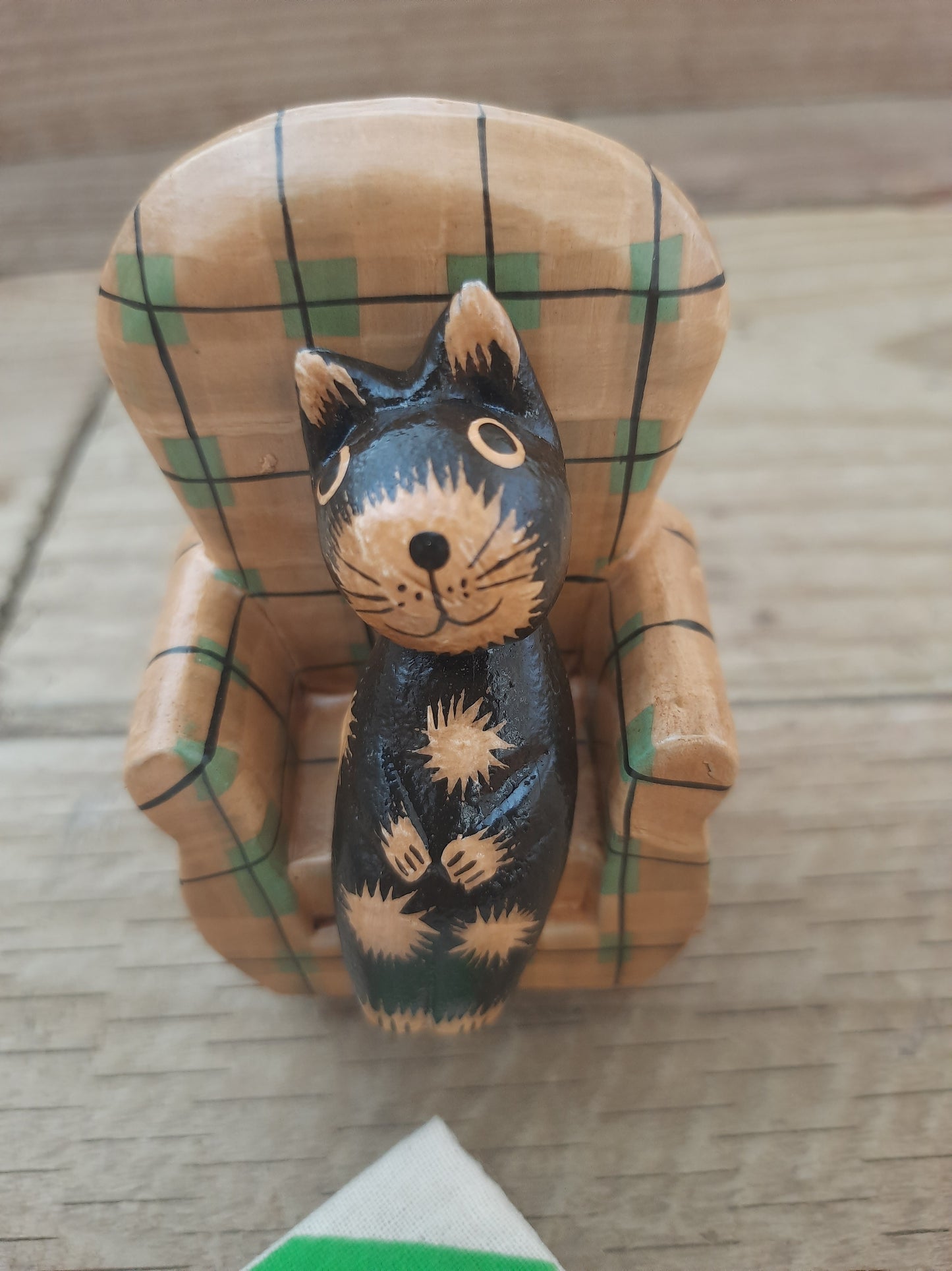 Wood Cat Lounging on Sofa