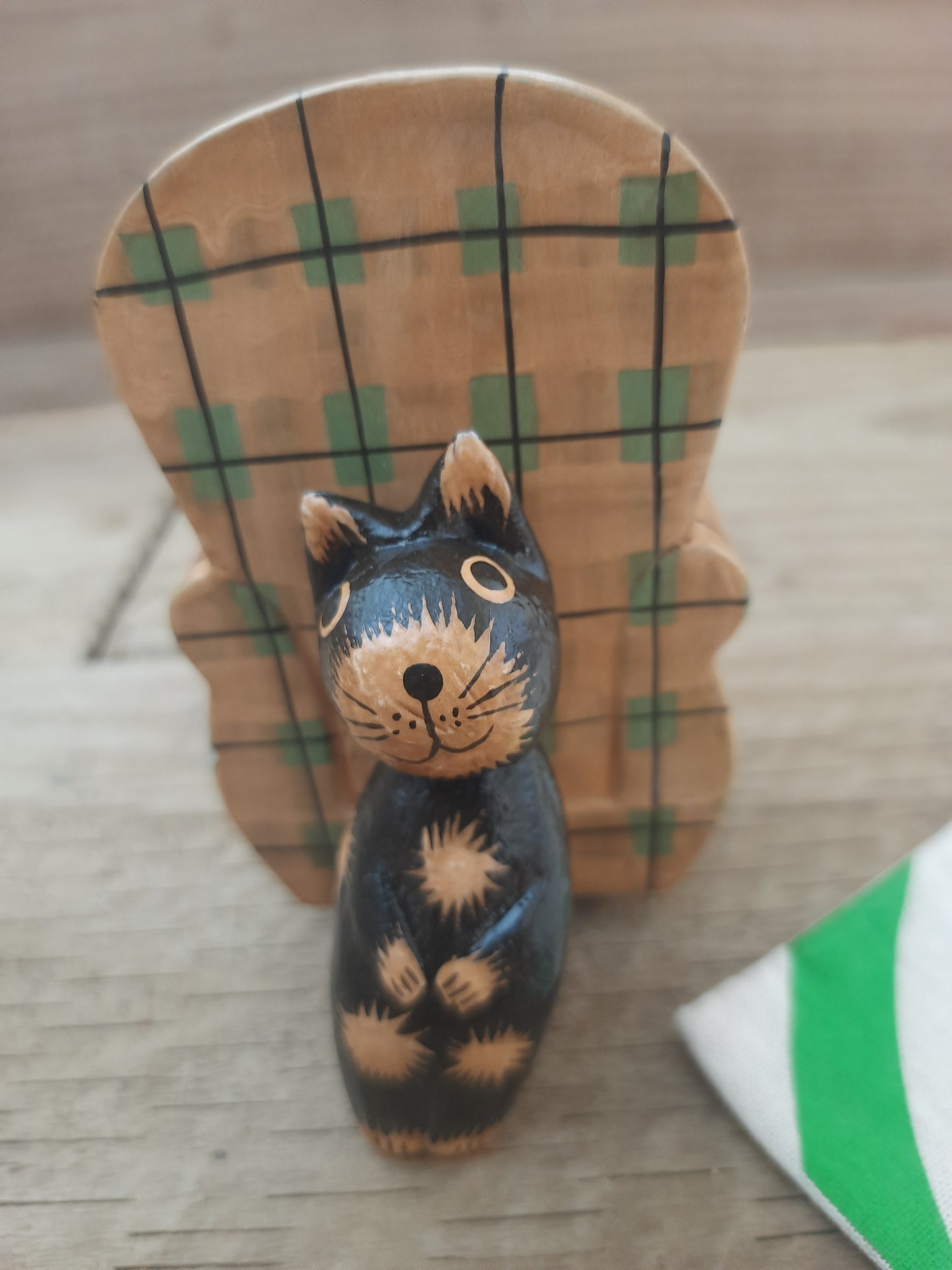 Wood Cat Lounging on Sofa