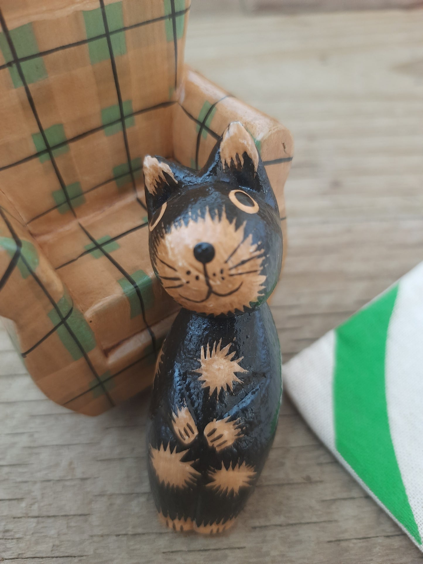 Wood Cat Lounging on Sofa