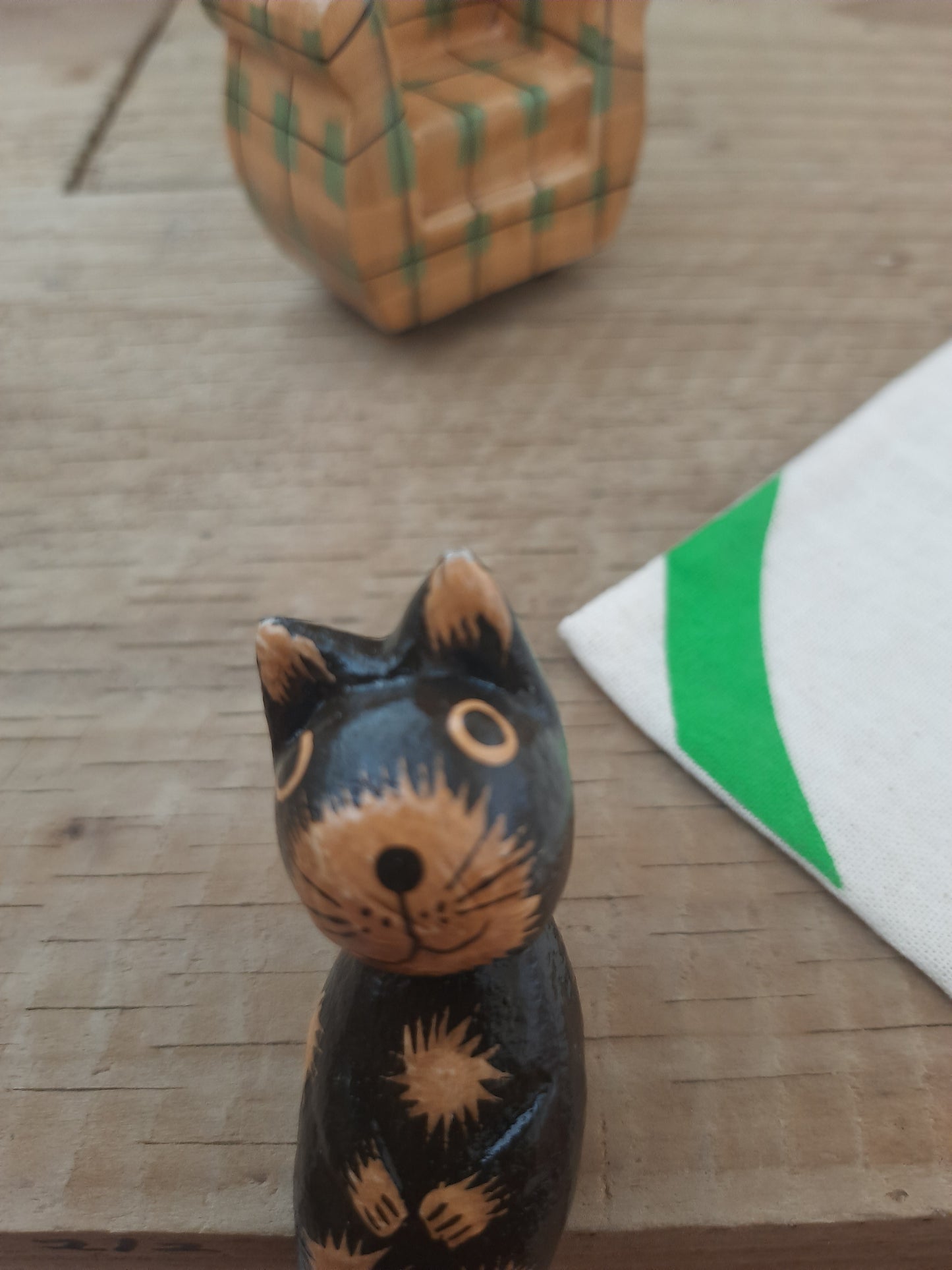 Wood Cat Lounging on Sofa
