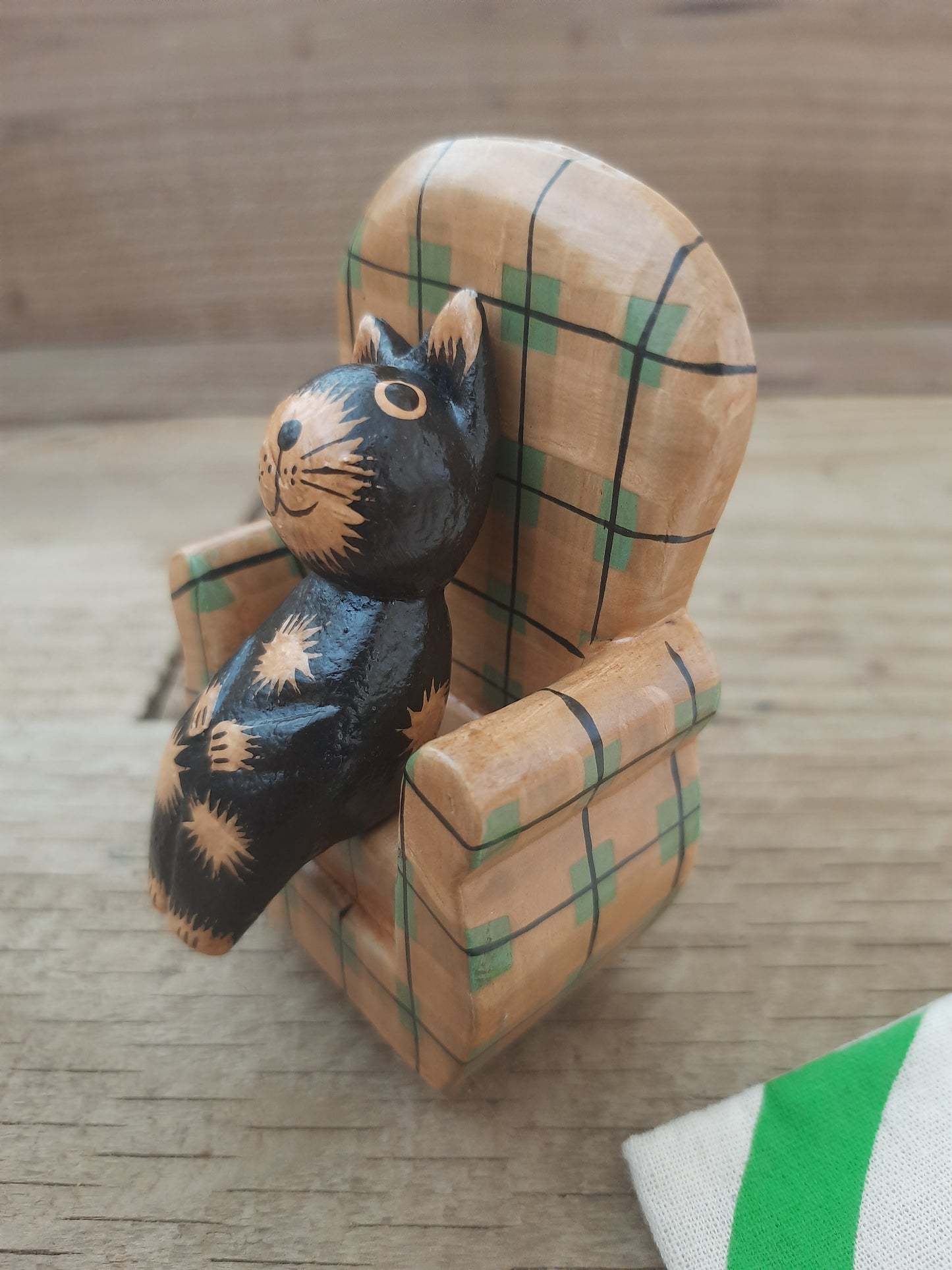 Wood Cat Lounging on Sofa