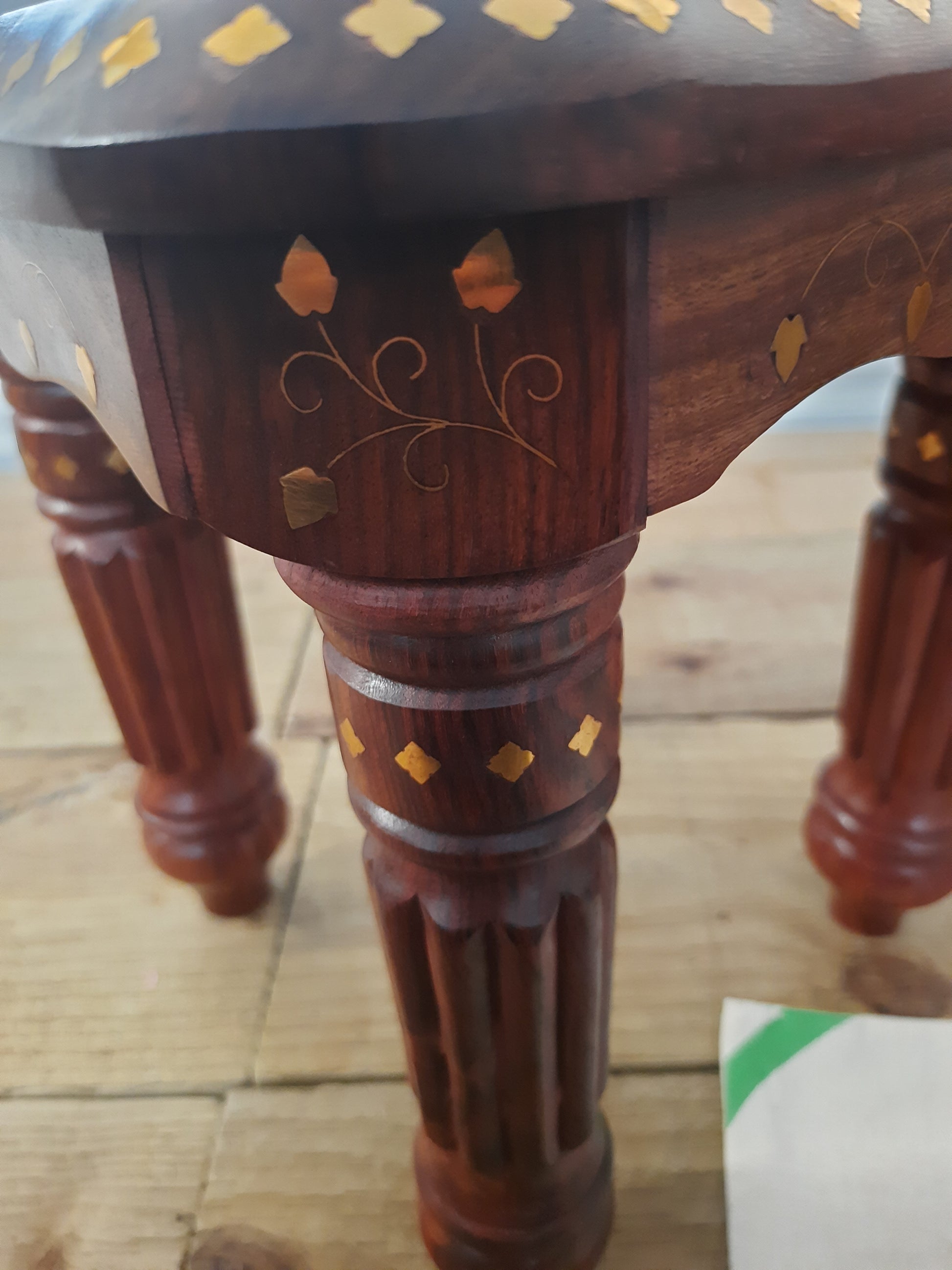 Close up of brass inlay on Sheesham wood table