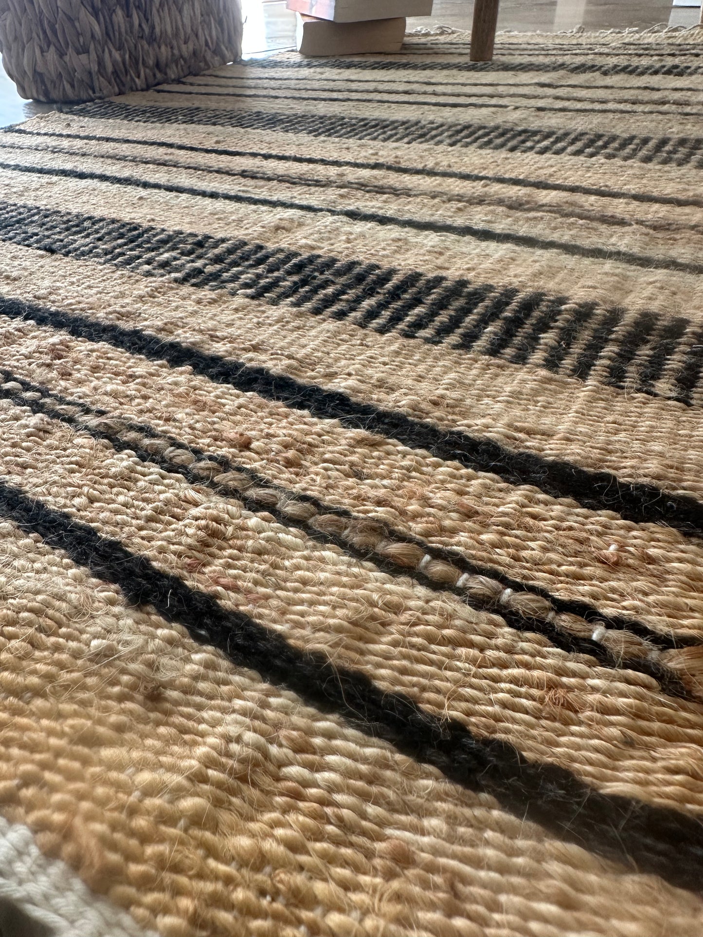 Close-up of black checkered detail on cotton rug