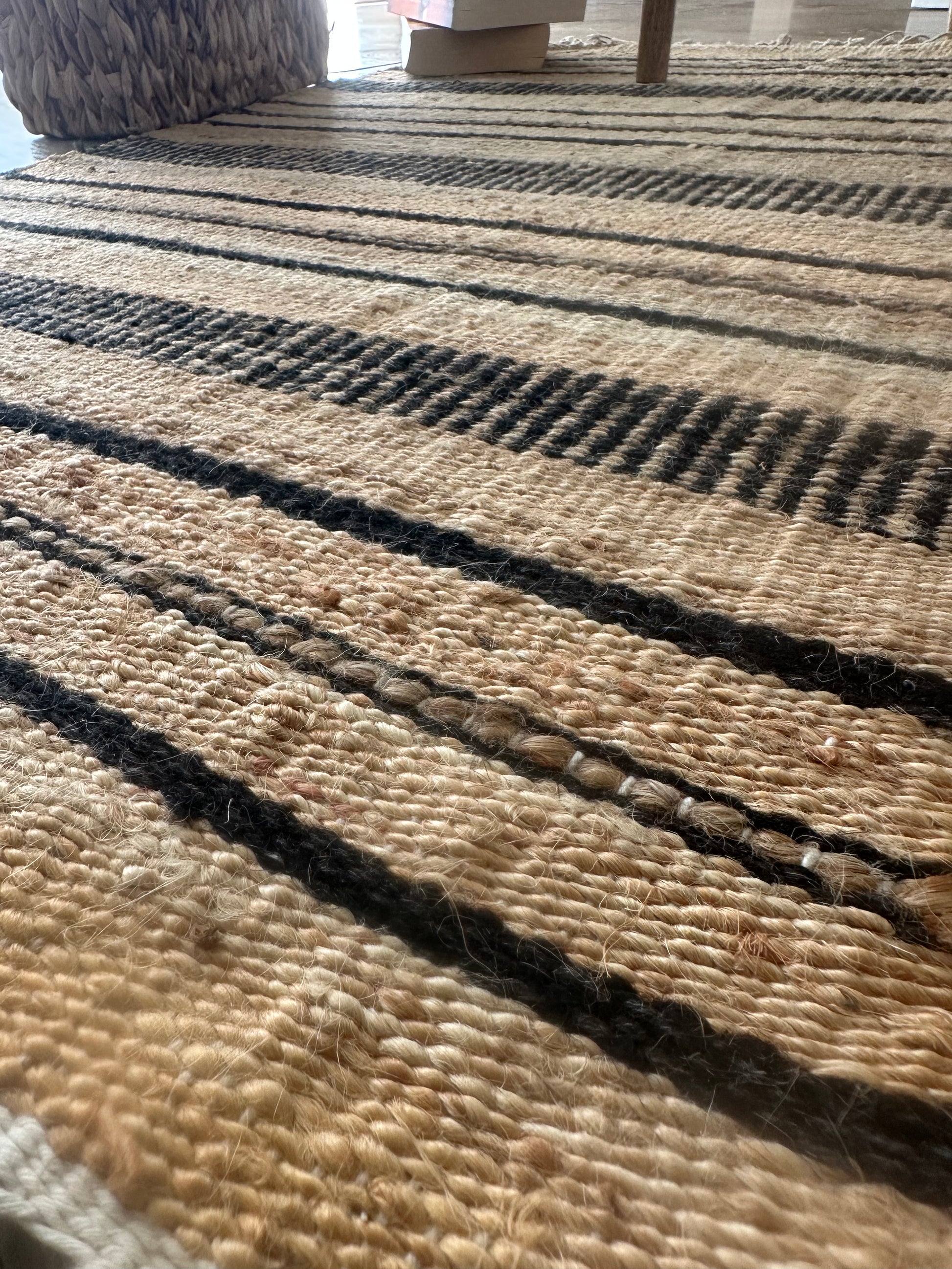 Close-up of black checkered detail on cotton rug