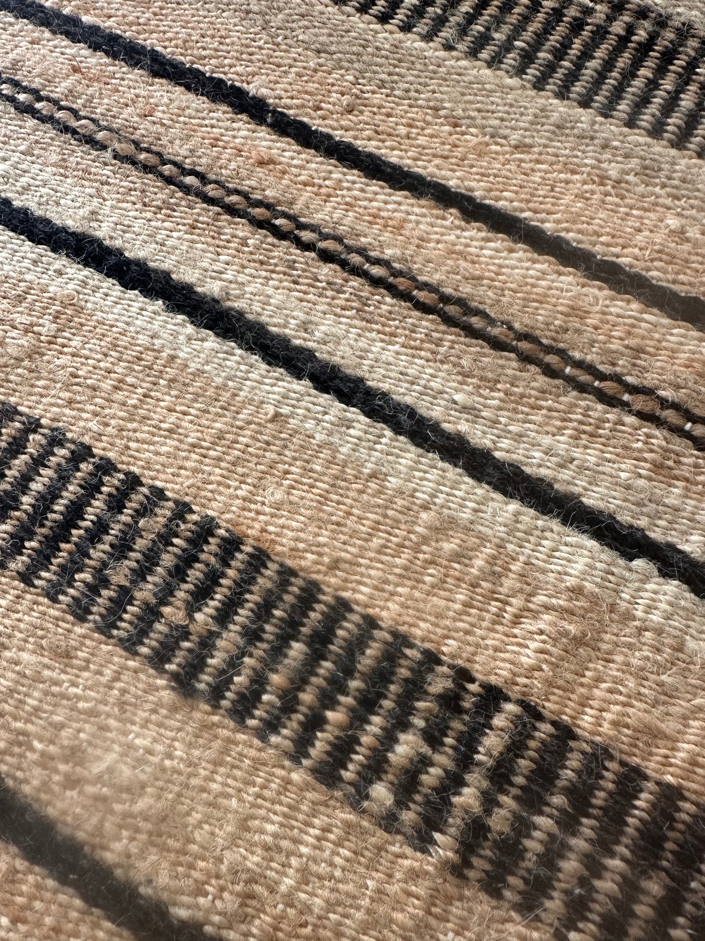 Dark and light beige cotton rug with contrasting pattern