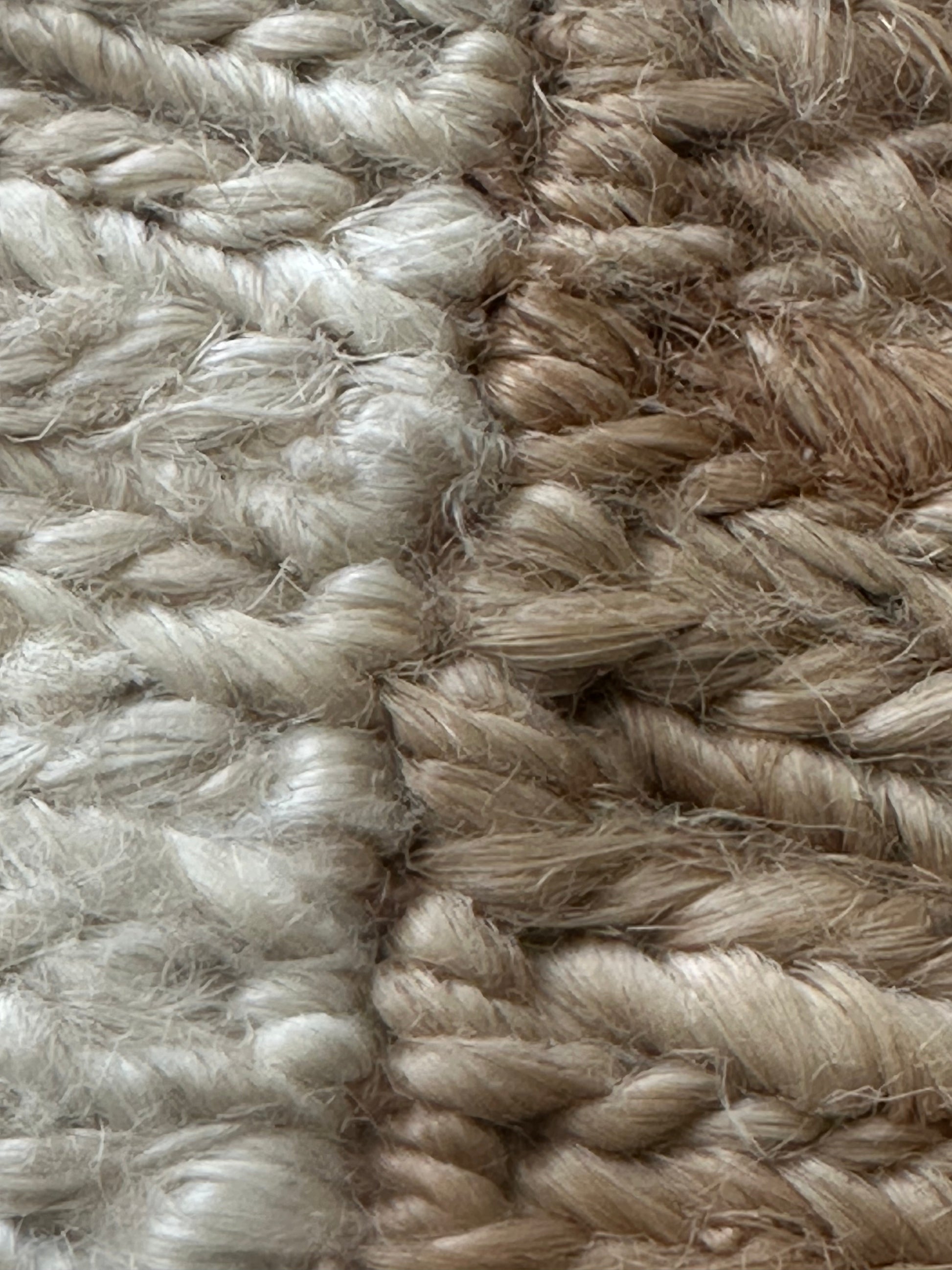 Jute rug with a lighter brown centre and border