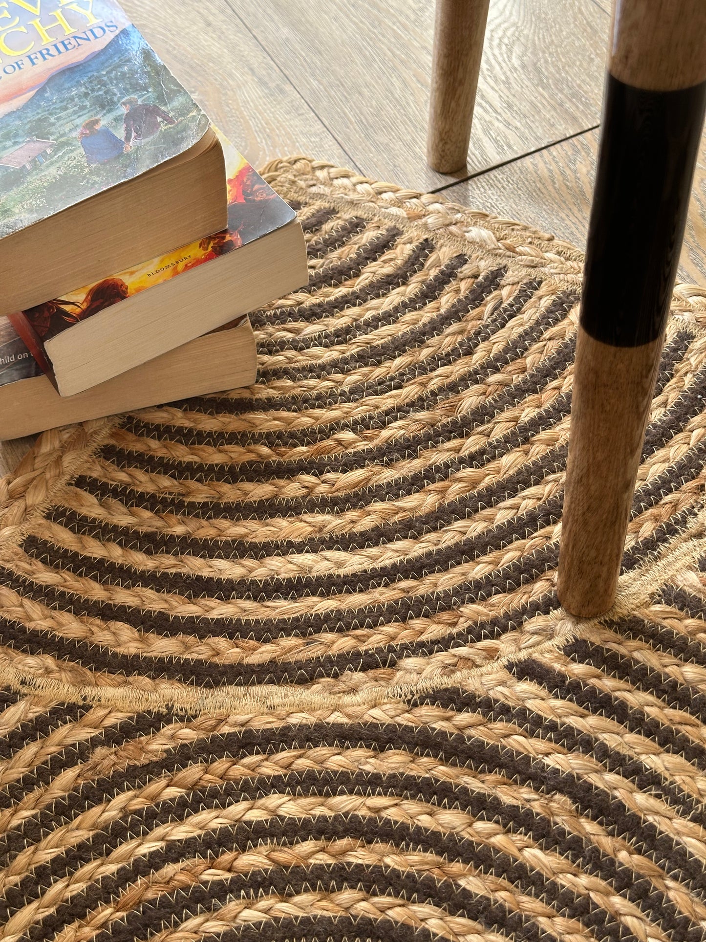 Close view of swirling brown jute rug pattern