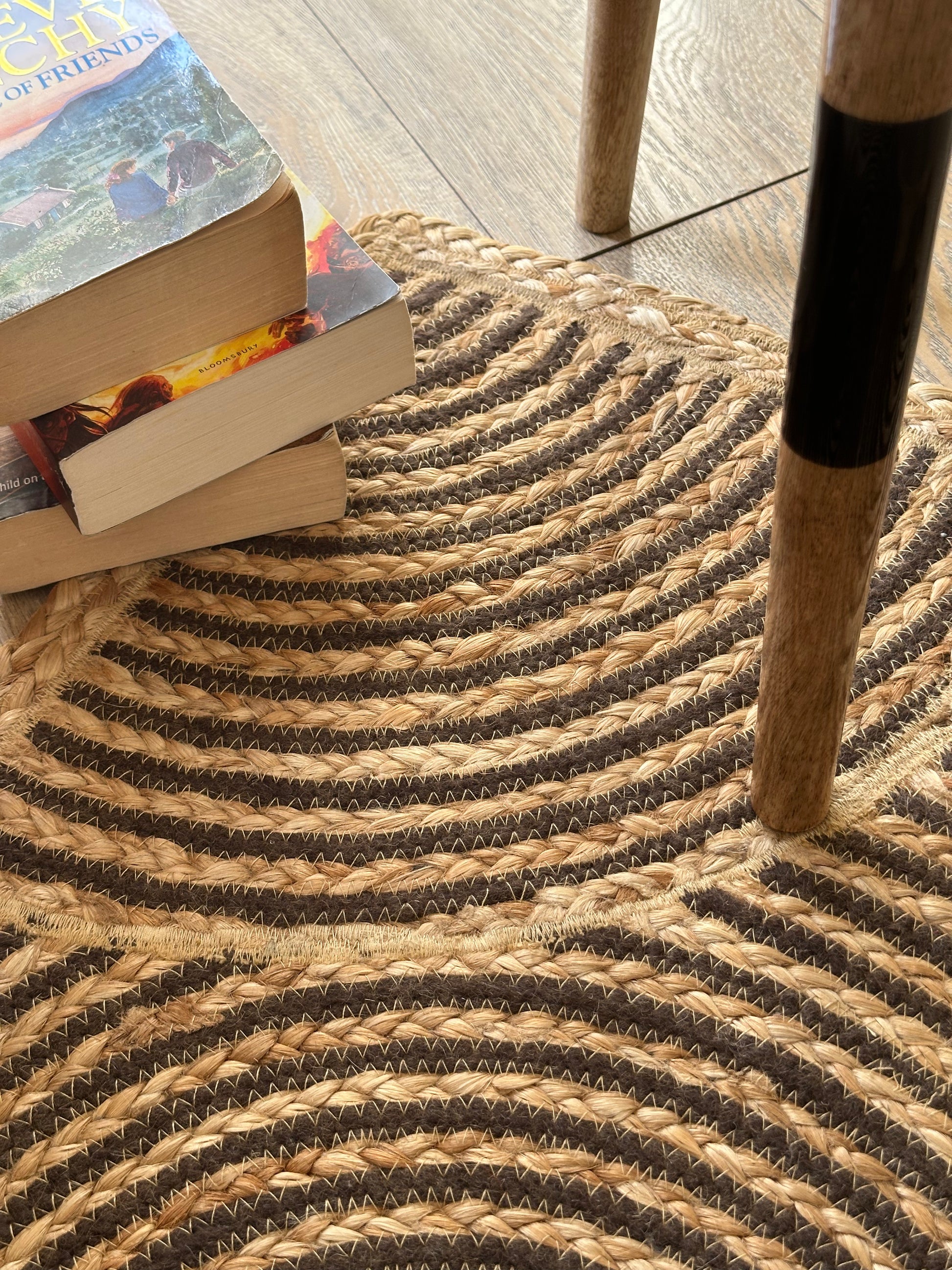 Close view of swirling brown jute rug pattern