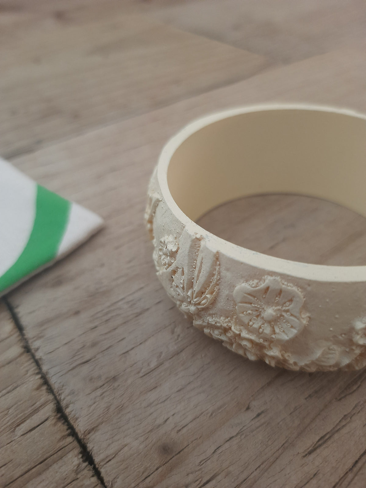 Hand-engraved off-white bracelet with raised detailing