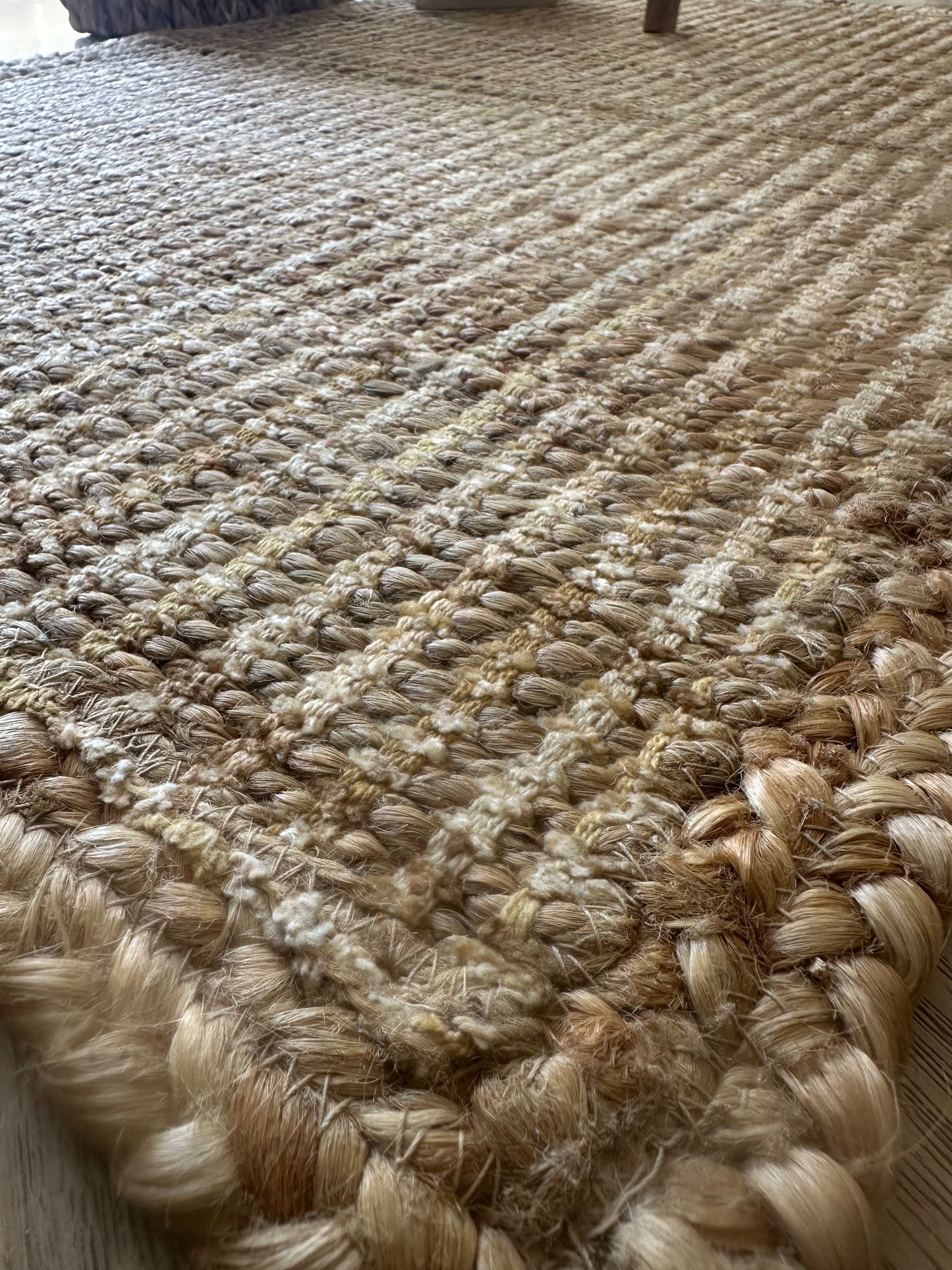 Close-up of tightly woven beige jute rug