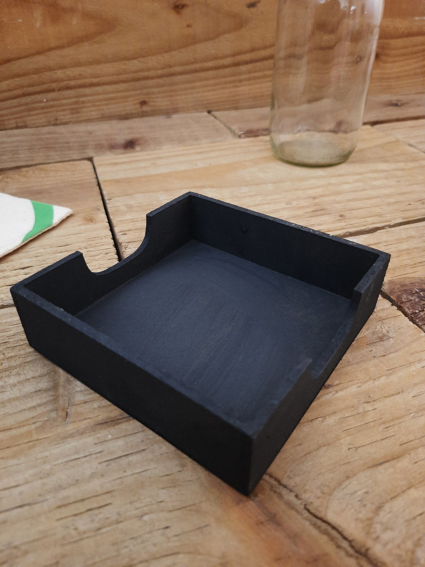 Set of elephant drink coasters displayed in wooden tray