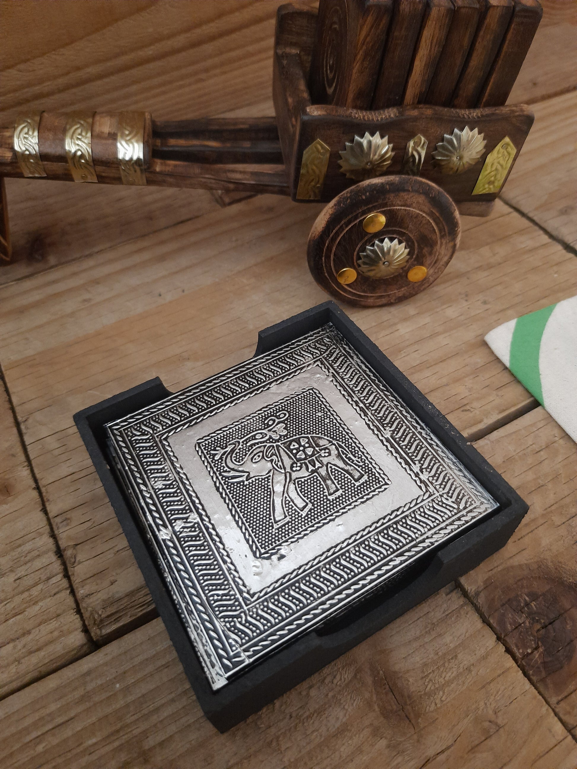 Elephant design coasters arranged on a dining table