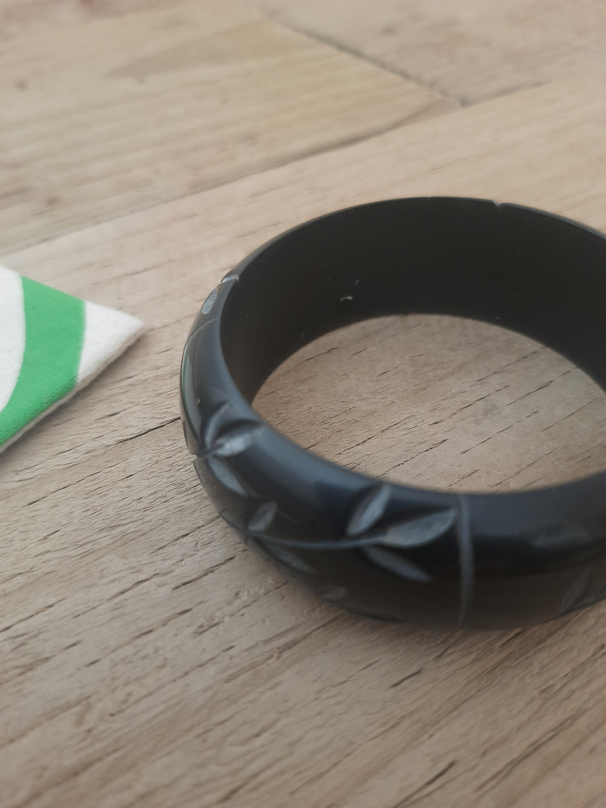 Engraved black bangle suitable as a gift for her