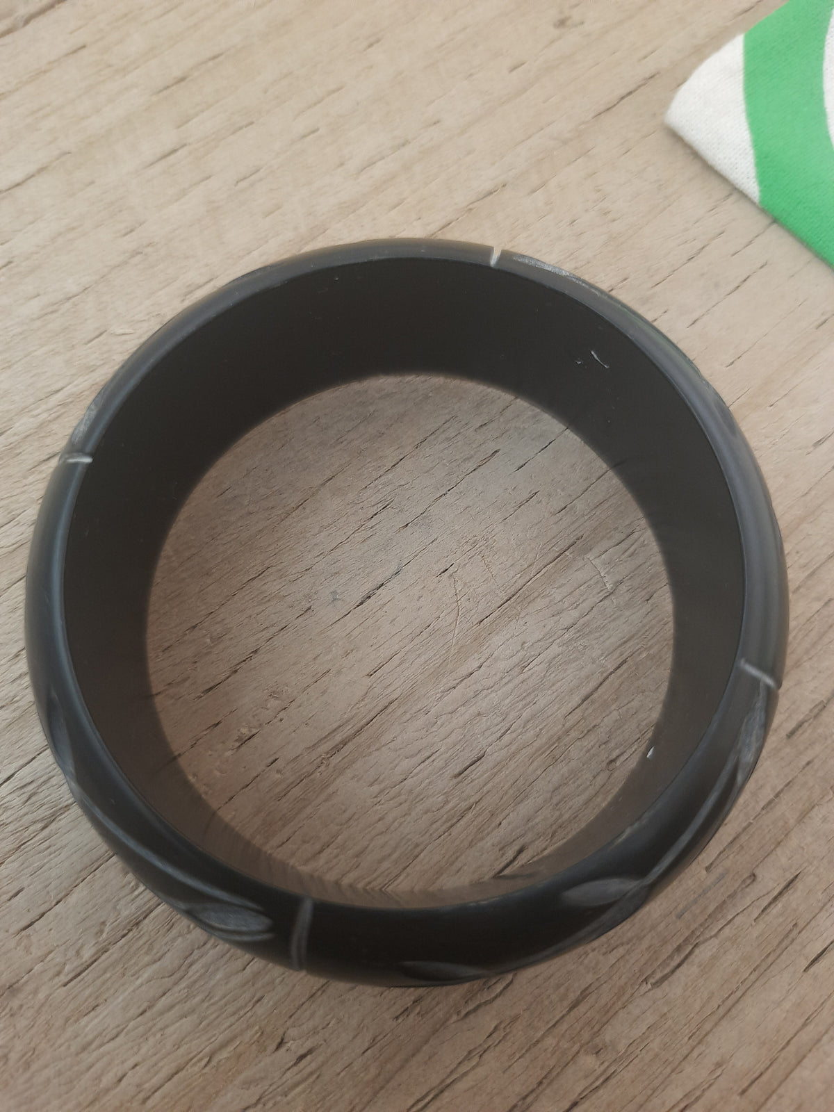 Fair Trade black bangle with floral detailing