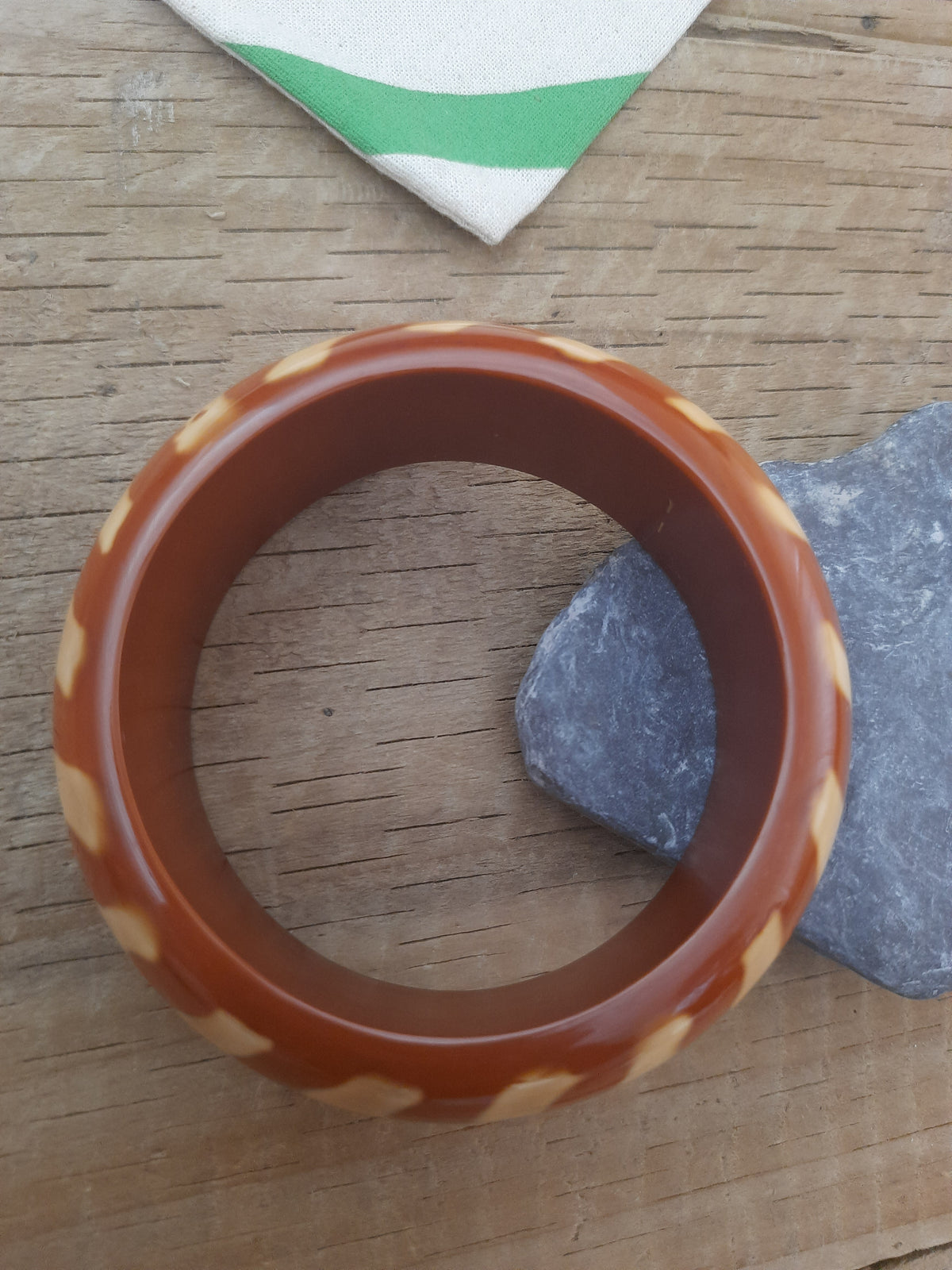 Elegant brown artisan bangle with flowing wavy lines
