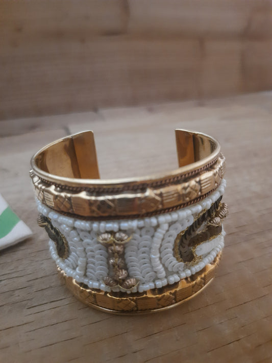 Gold and brown beaded half cuff with white detailing