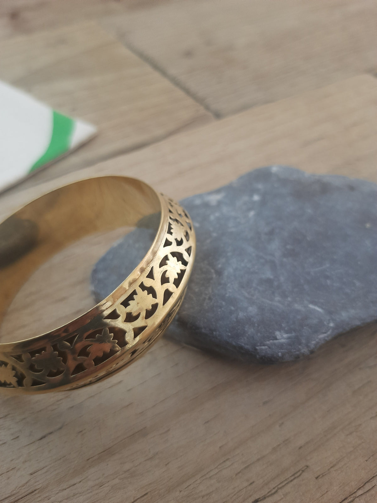 Elegant gold floral bangle with intricate detailing
