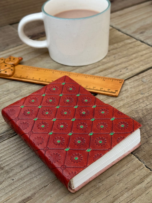 Green mini leather notebook with embossed decorative cover
