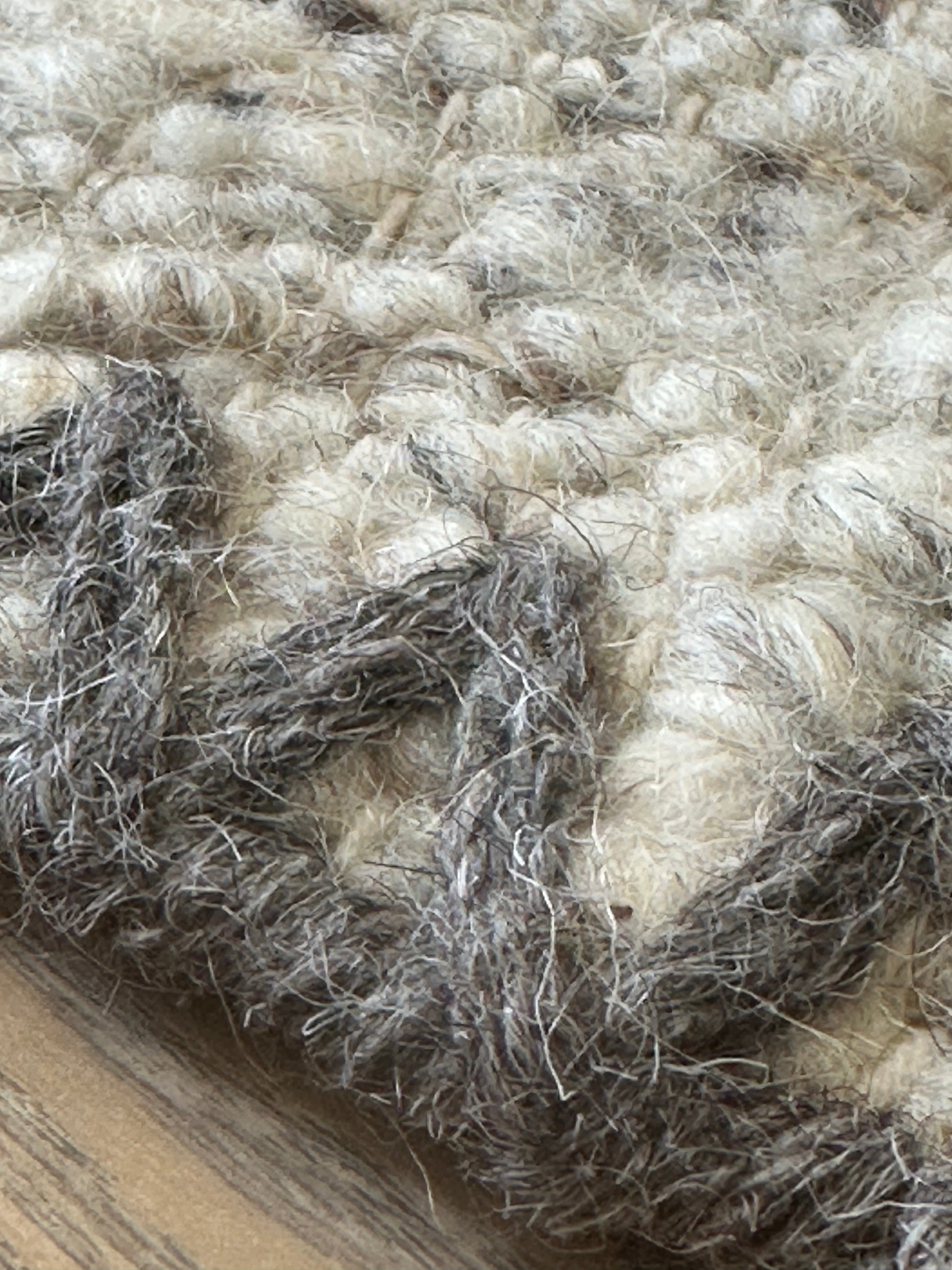 Grey and white rug with mixed woven pattern