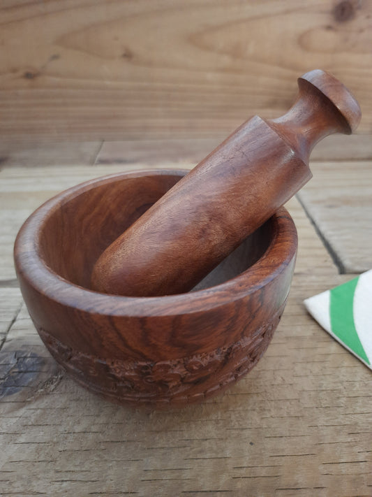 Hand carved wooden mortar and pestle with engraved floral design