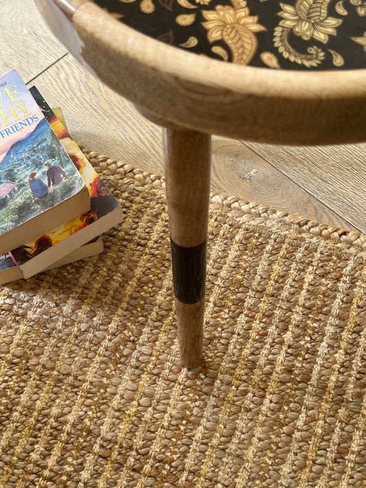 Beige striped jute rug with yellow and brown streaks