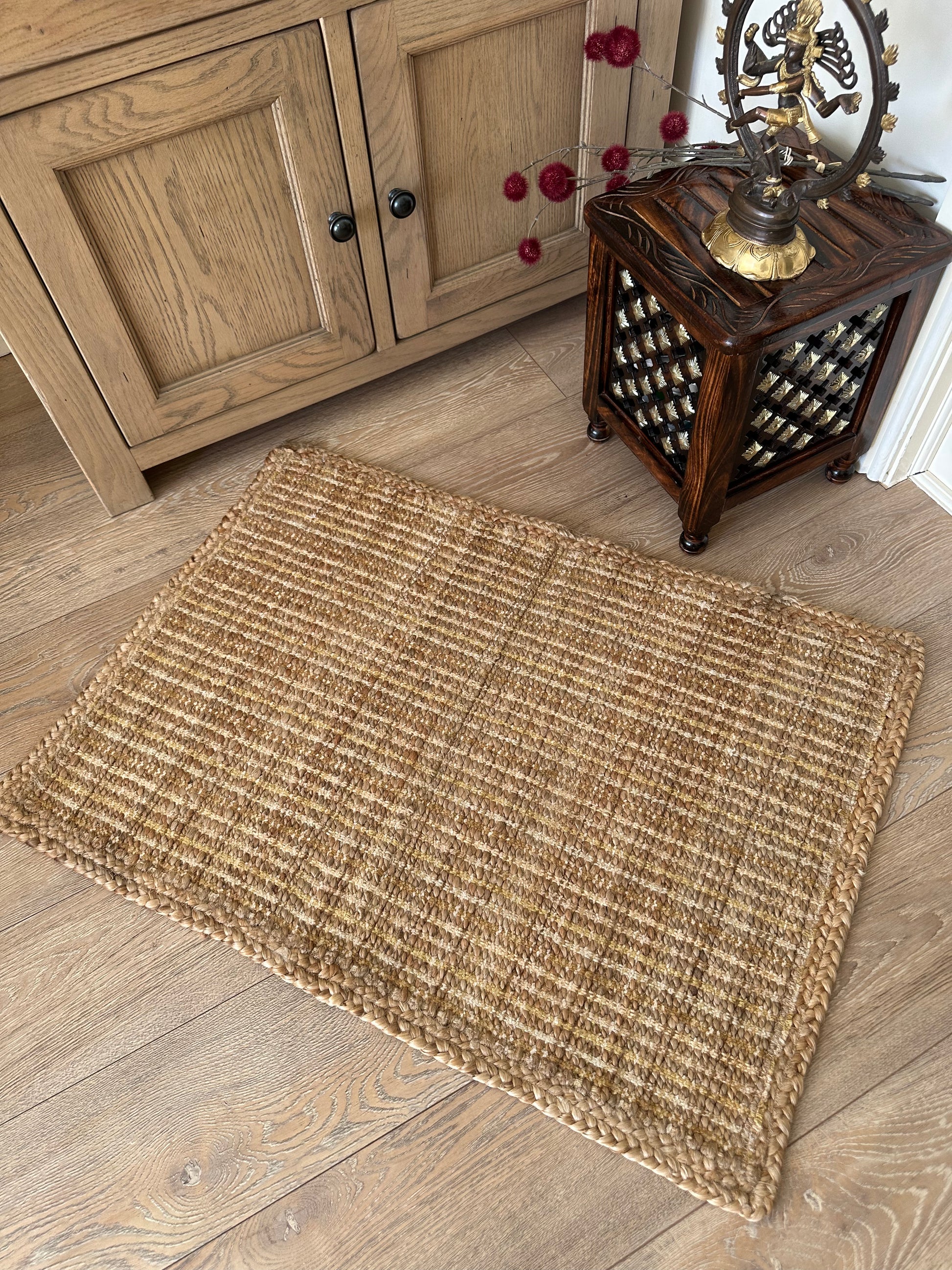 Handmade beige jute rug with woven texture