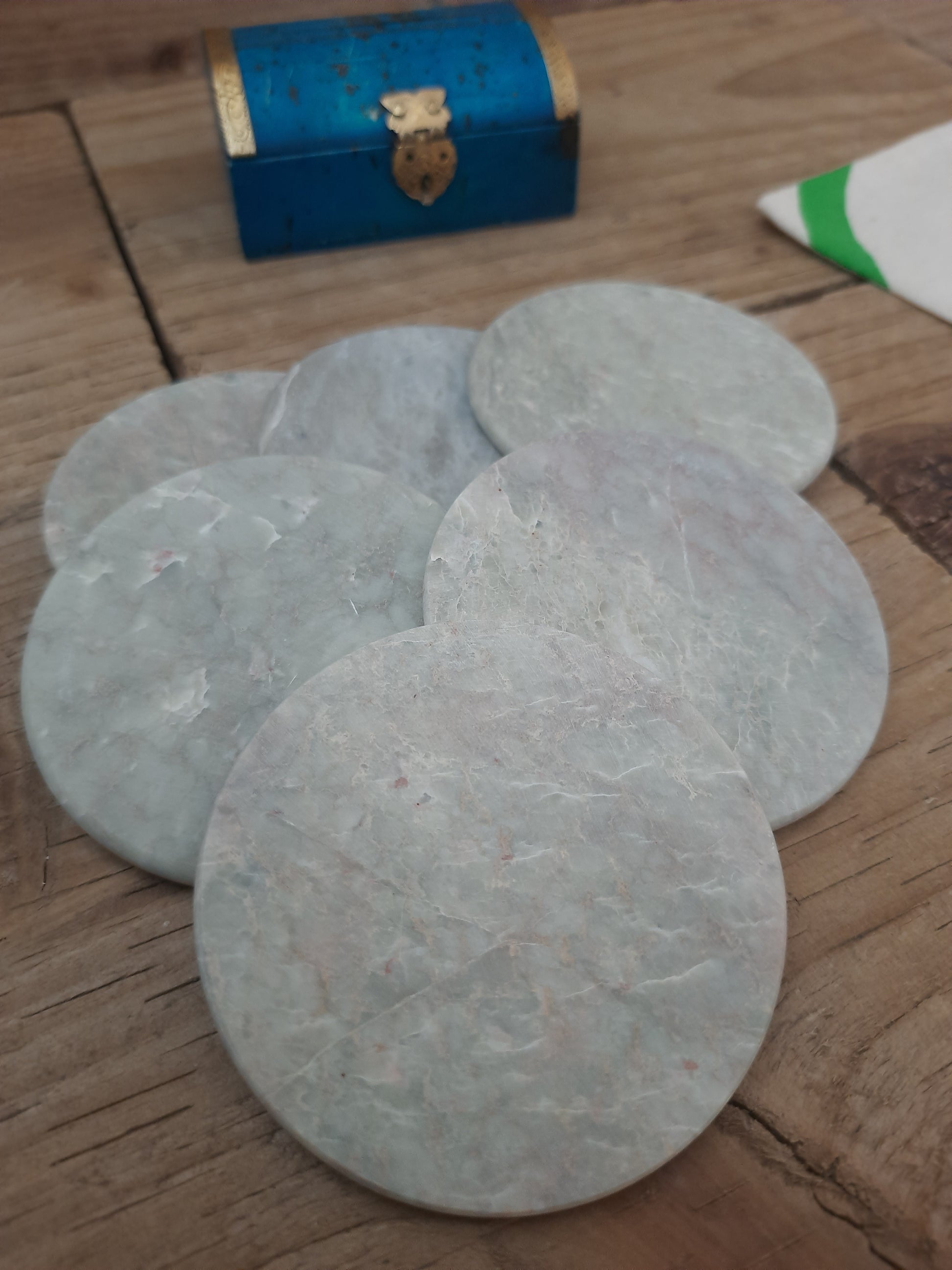 Handmade soapstone drink coasters with natural markings