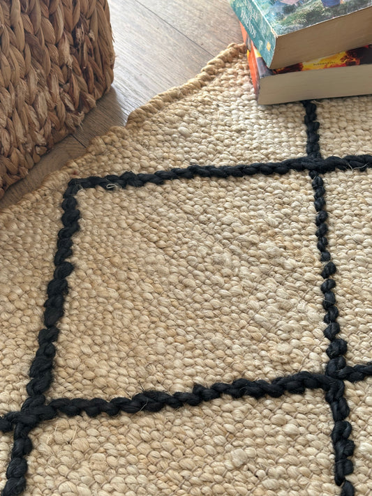 White jute rug with black diamond pattern