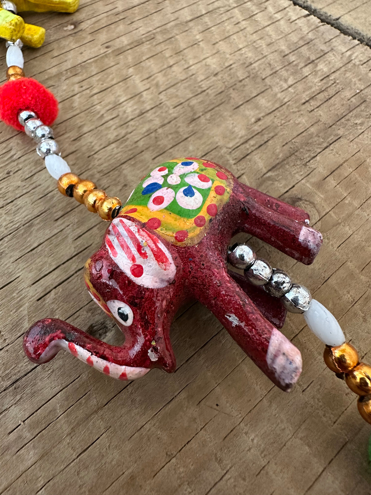 Yellow green and burgundy elephant hanging