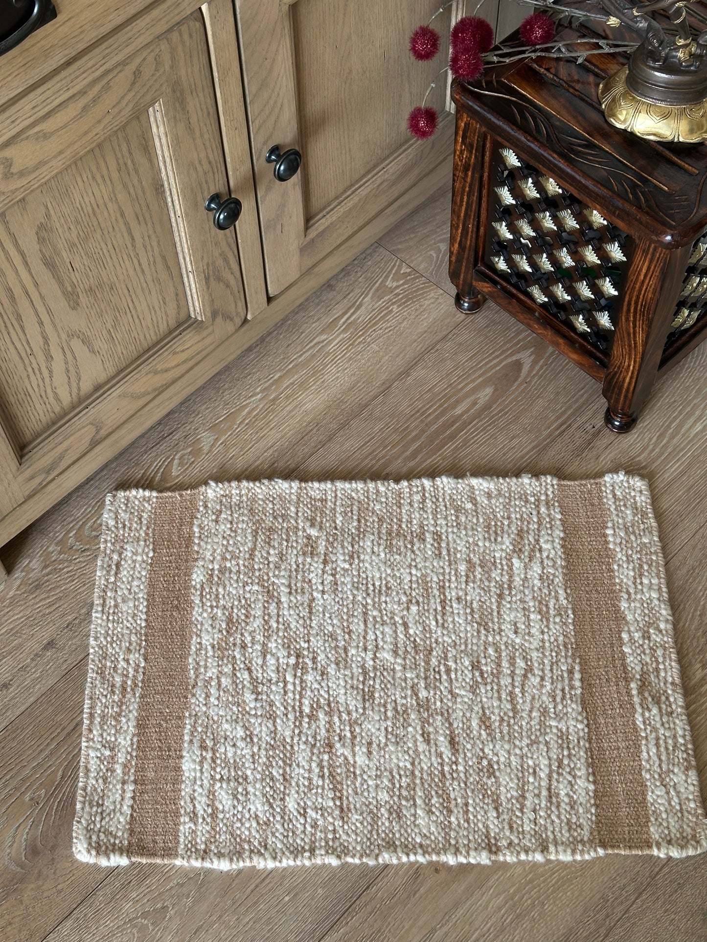 Small brown and white wool rug for the home