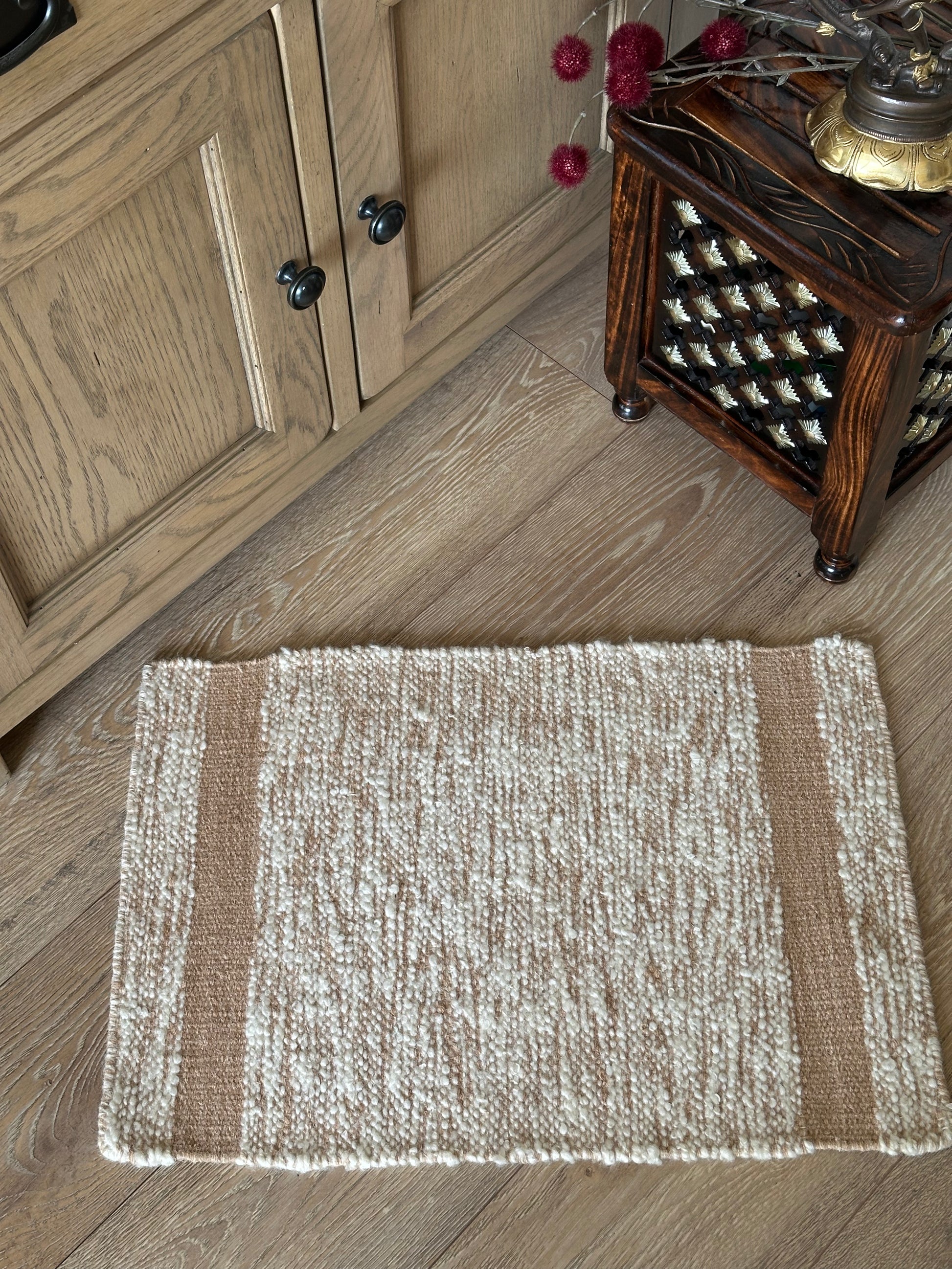 Small brown and white wool rug for the home