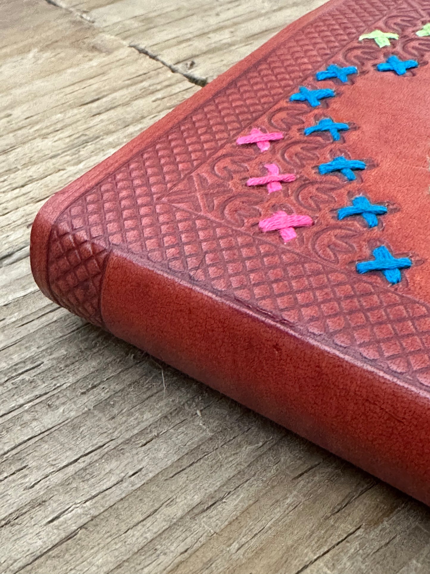 Close-up of leather binding and corner detail on notebook