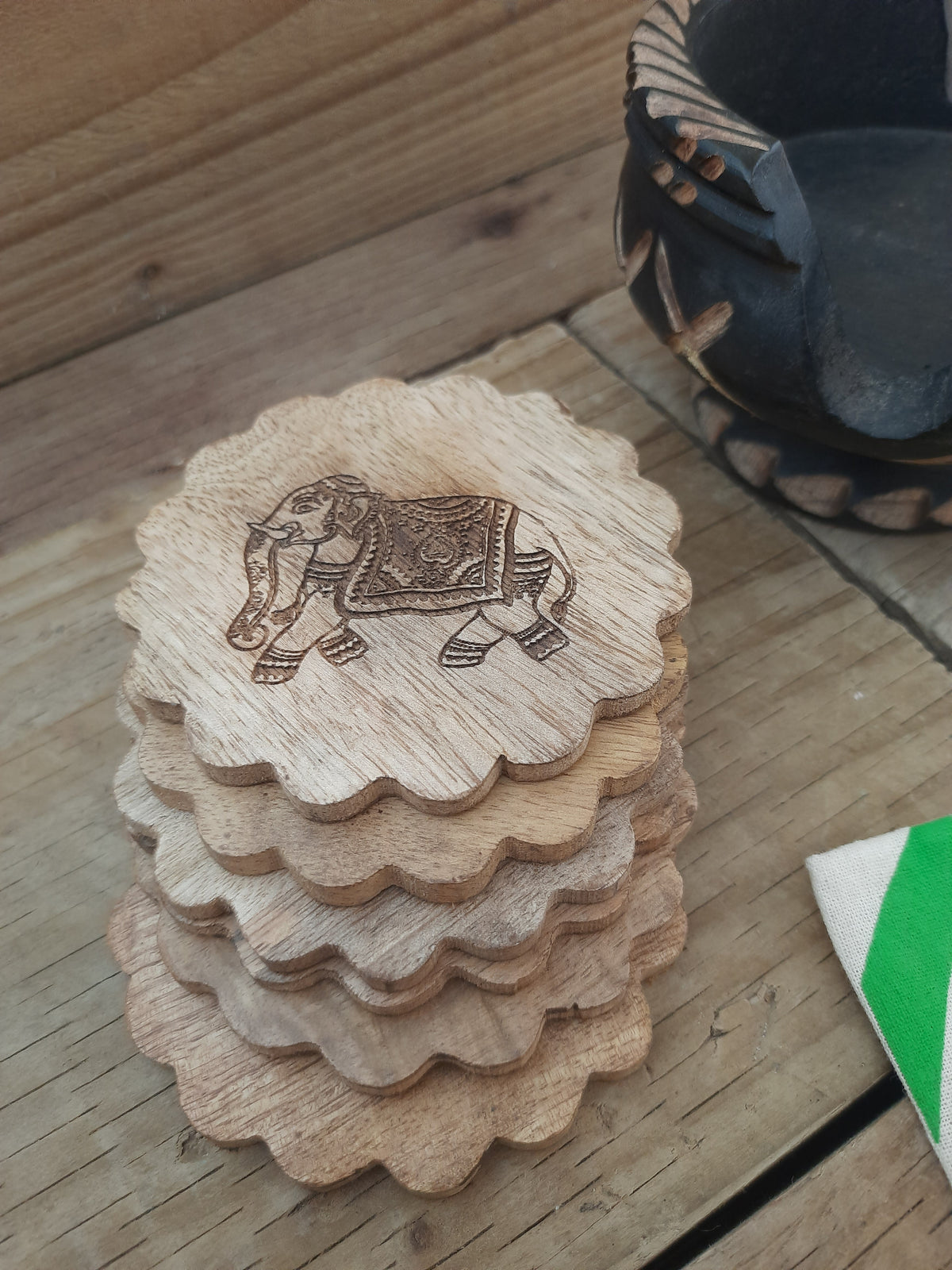 Hand-carved mango wood coaster with elephant design