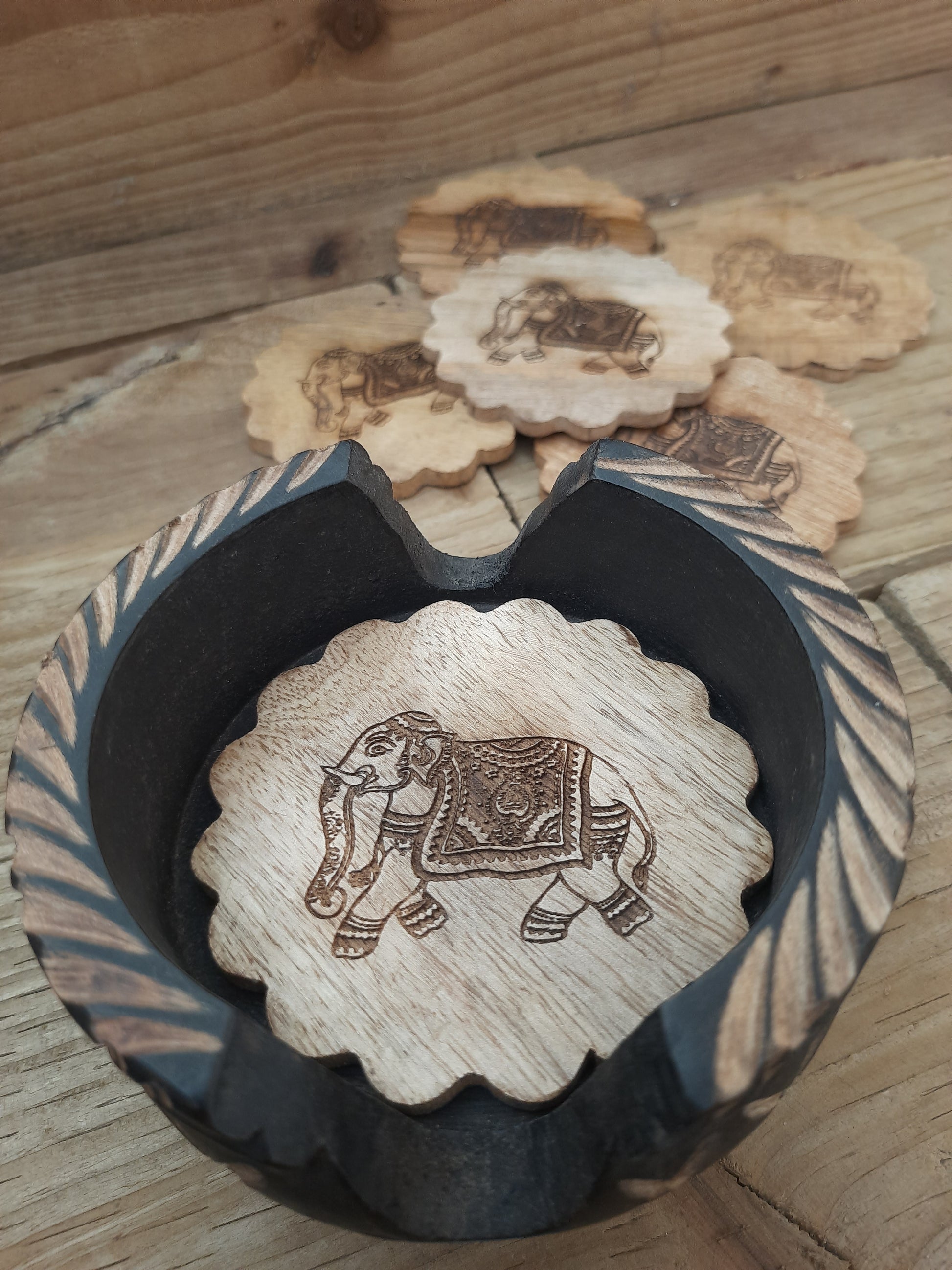 Natural mango wood drink coasters with carved detailing