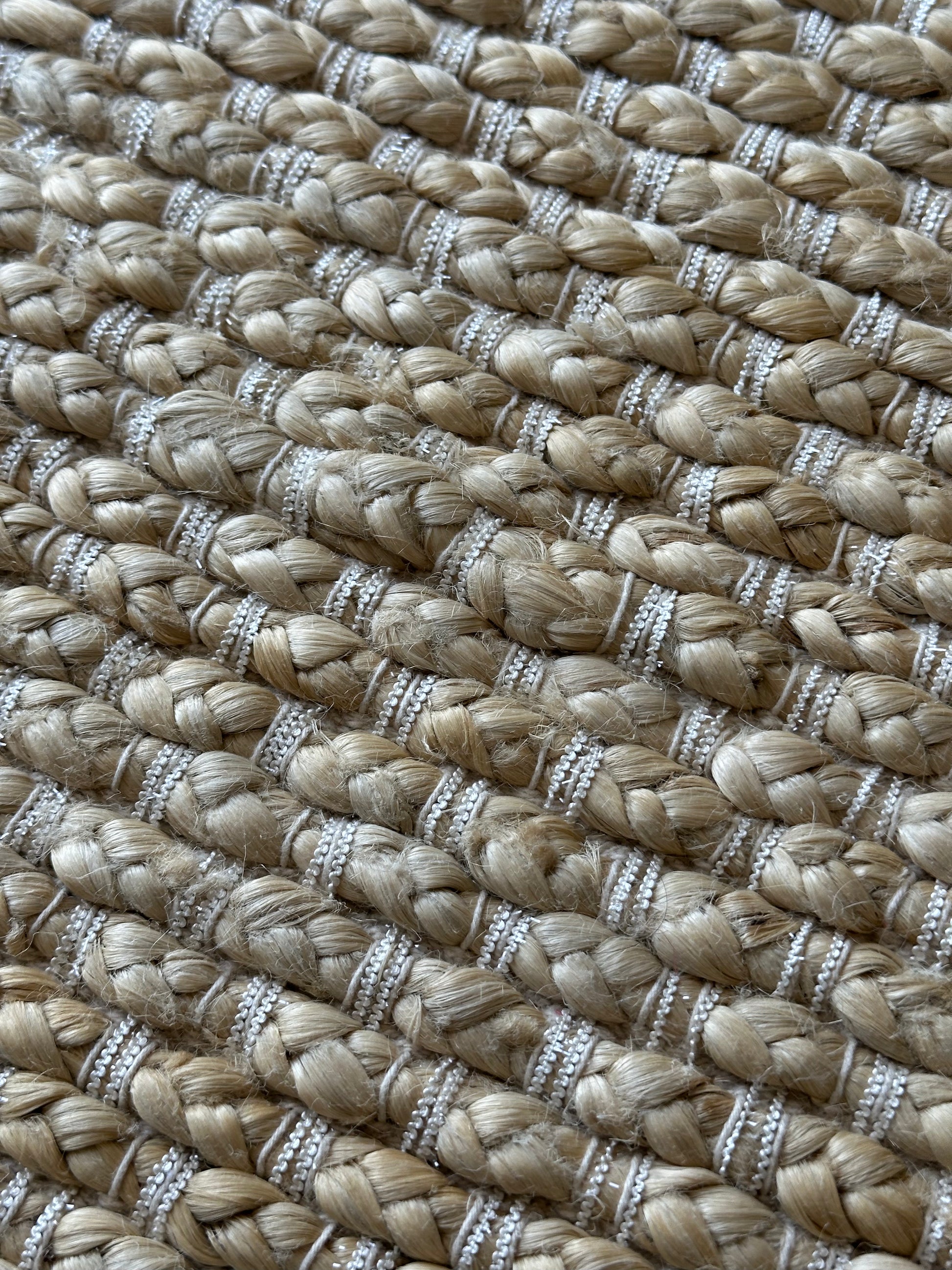 Natural jute rug finished with tassels