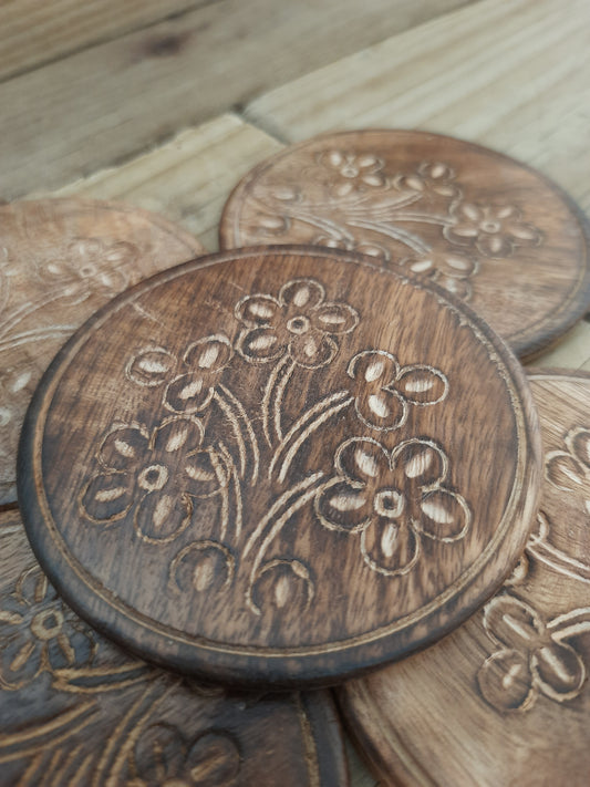 Rustic mango wood coasters with floral detailing