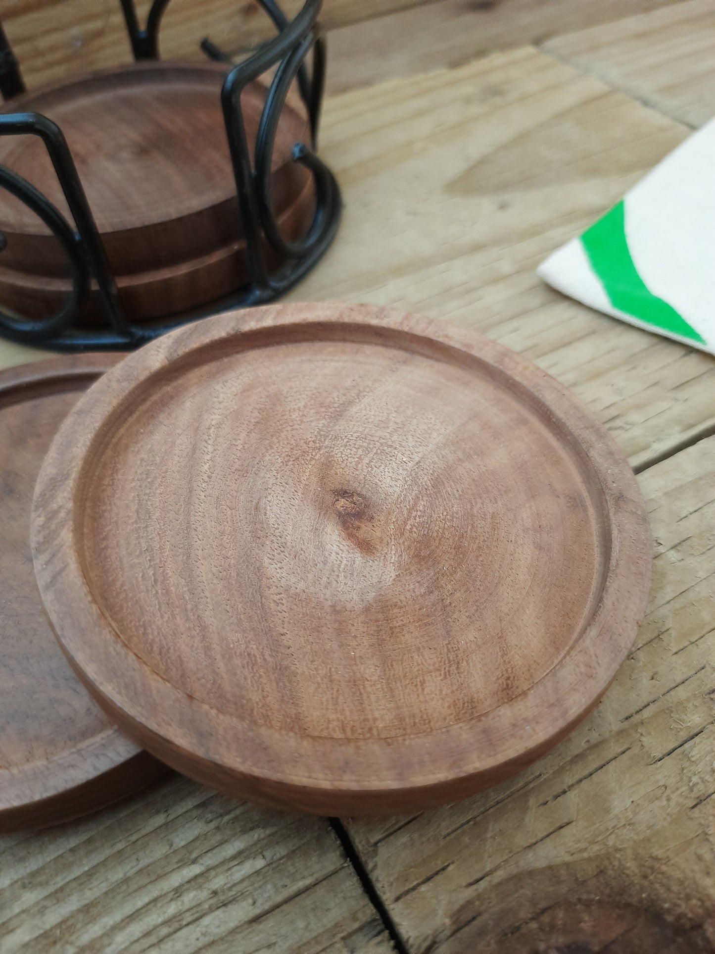 Round mango wood drink coasters showing natural wood 