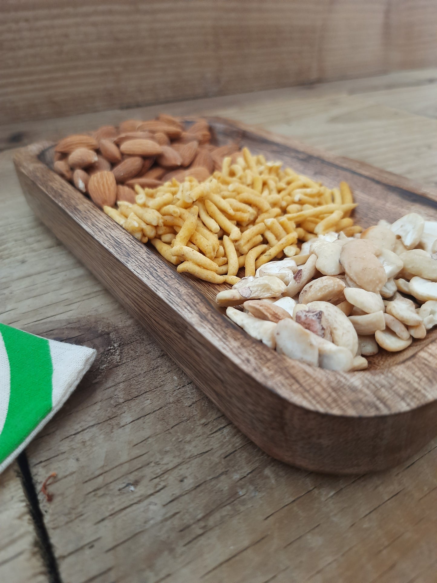 Natural wooden serving tray styled for entertaining